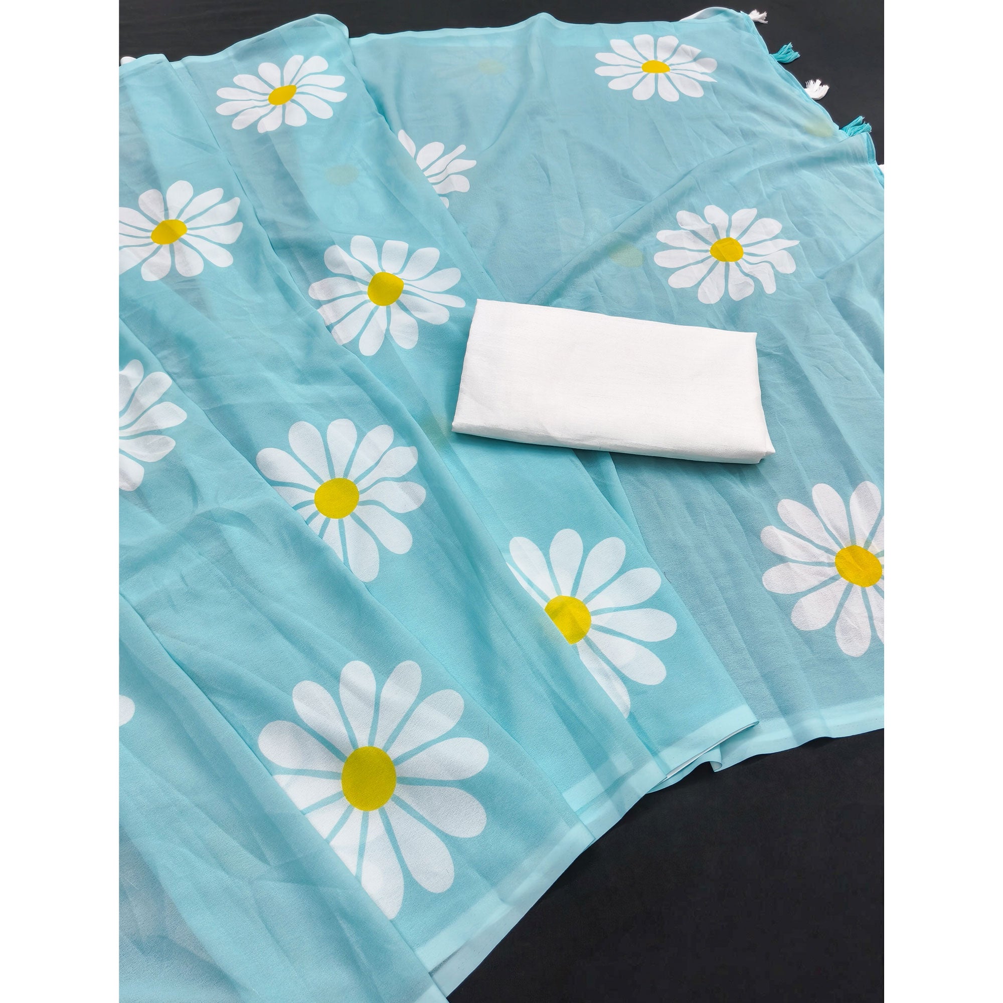 Sky Blue Georgette Saree Featuring Delicate Floral Prints & Tassels Pallu