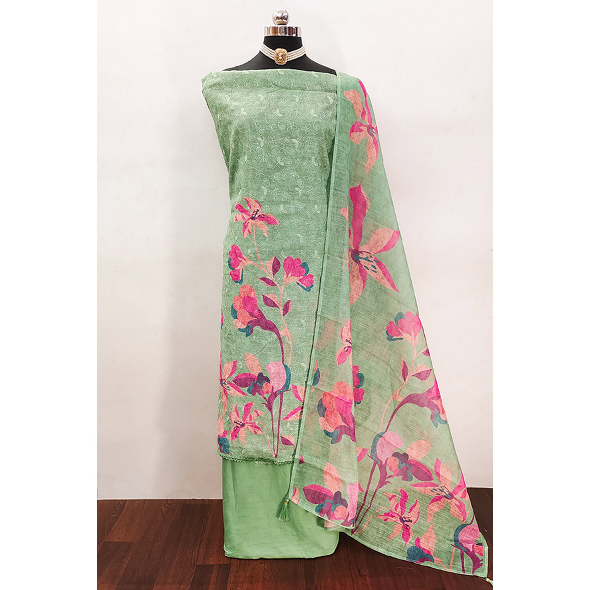 Green Linen Dress Material Adorned with Artistic Floral Print and Elegant Thread Embroidery