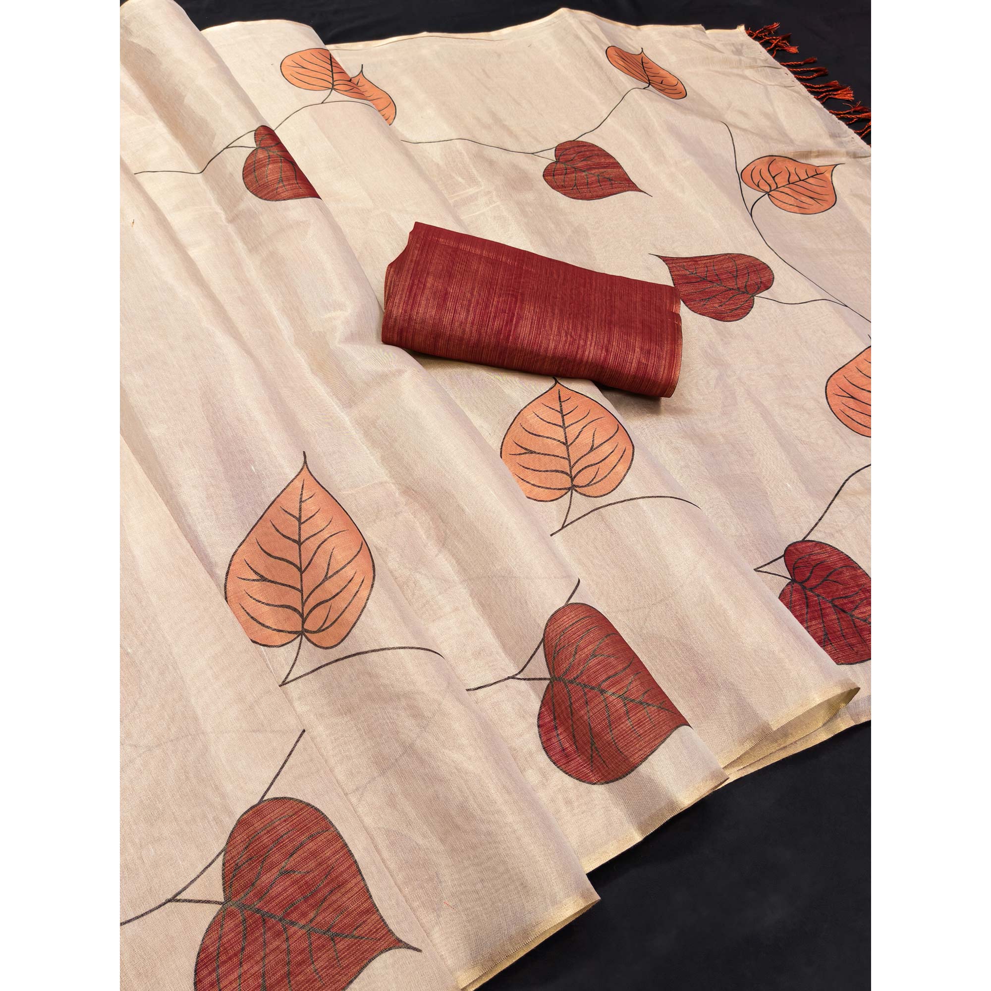 Beige & Rust Saree in Art Silk Featuring Leafy Print & Tassels