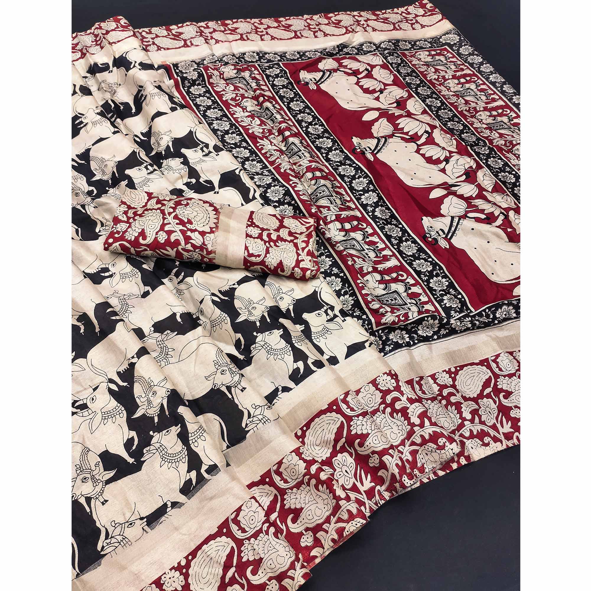 Black & Red Cotton Blend Saree Featuring Artistic Animal And Floral Print Fusion