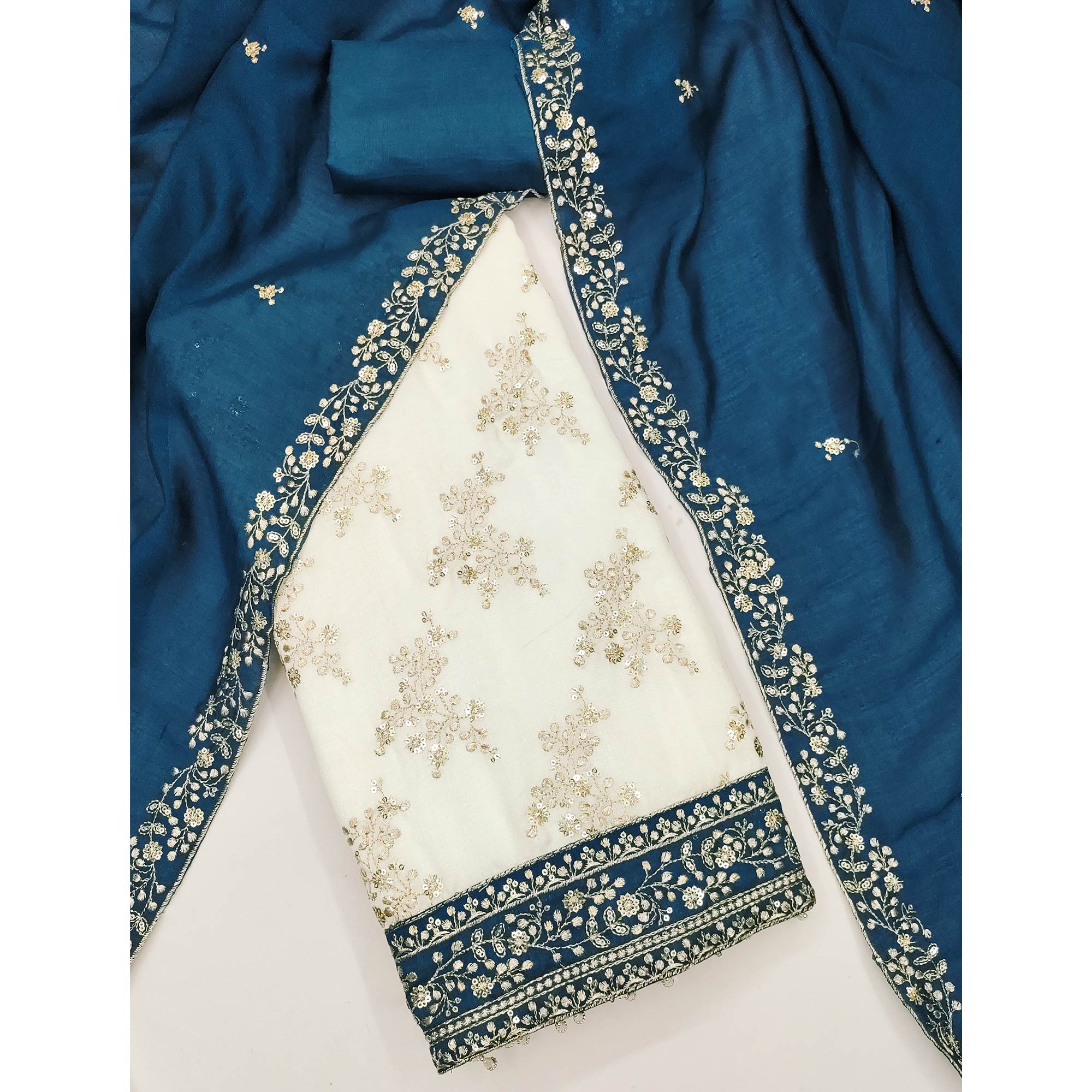 Teal and Off White Vichitra Silk Fabric with Embroidered Detailing