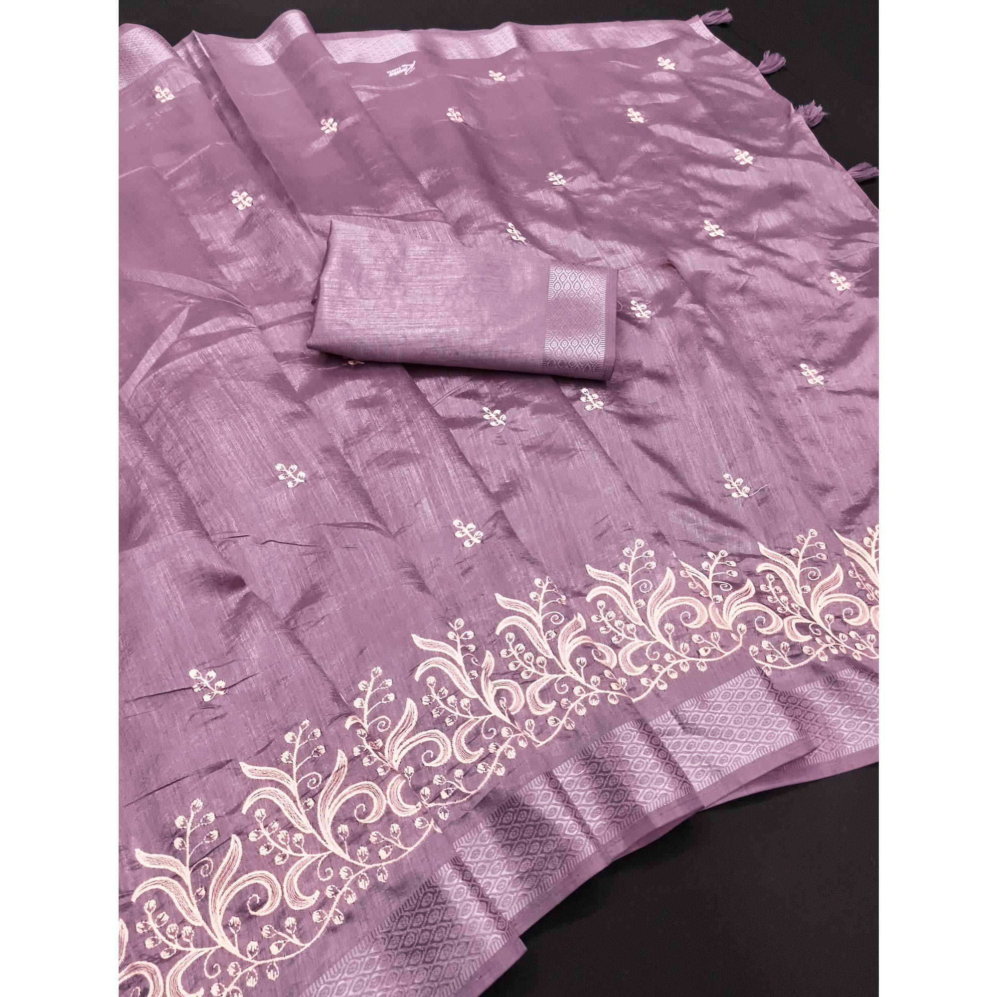 Lavender Art Silk Saree Adorned With Delicate Floral Embroidery & Stylish Tassel Pallu
