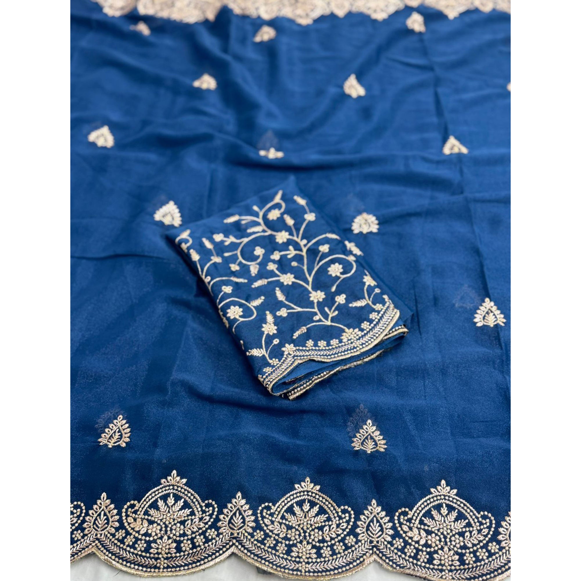 Gorgeous Blue Floral Embroidered Georgette Saree Accented With Luxurious Zari Work