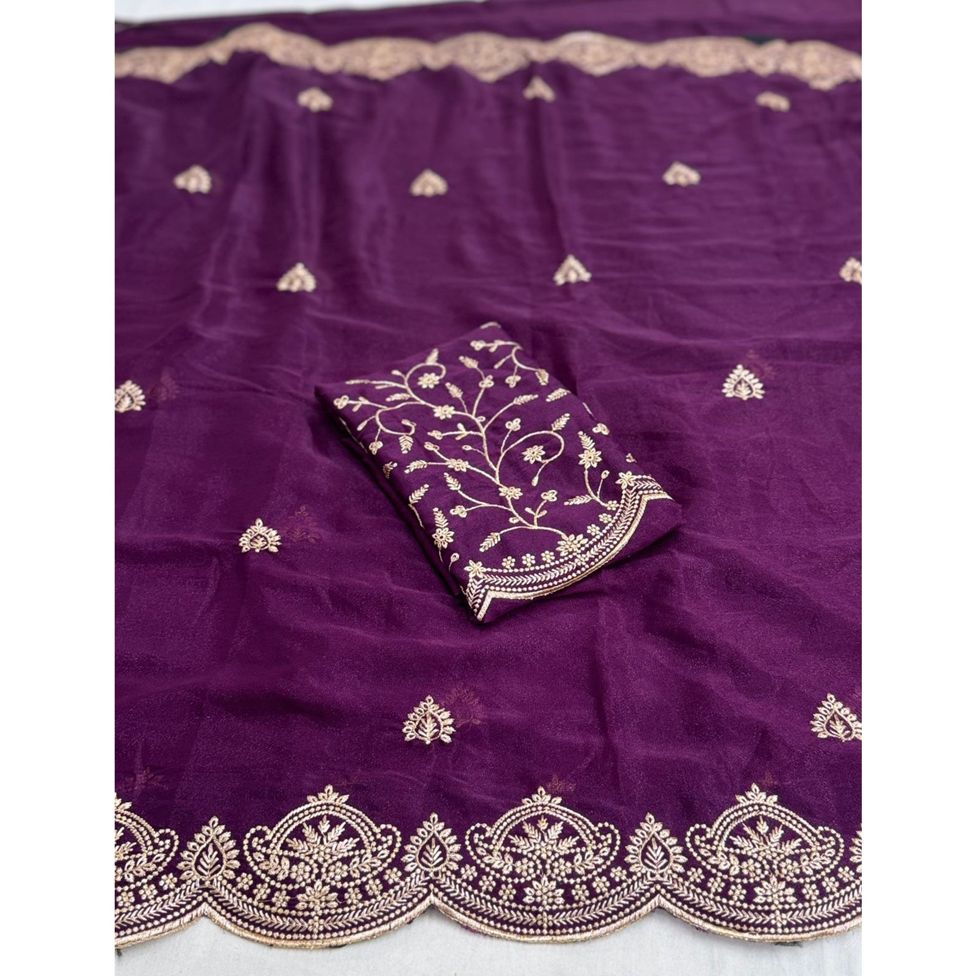 Gorgeous Purple Floral Embroidered Georgette Saree Accented With Luxurious Zari Work