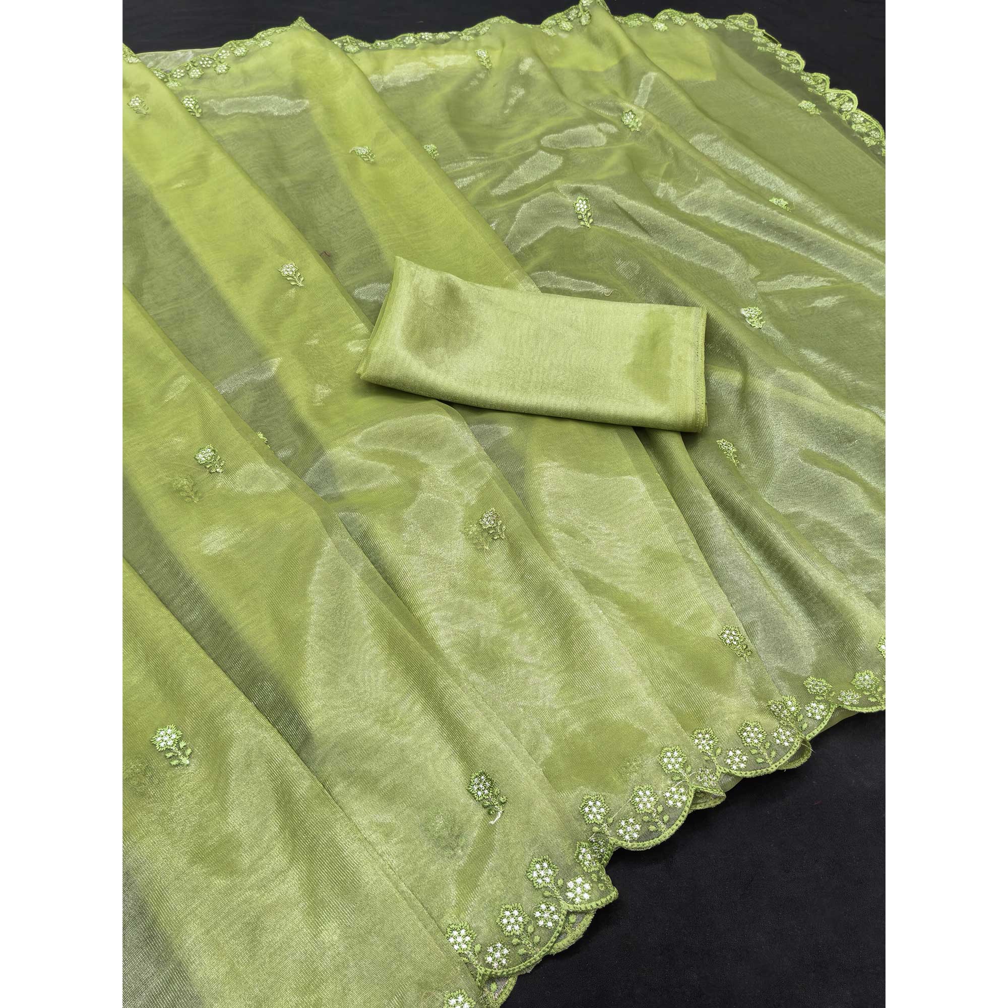 Green Net Partywear Saree Featuring Fine Floral Embroidery and a Soft, Flowing Look