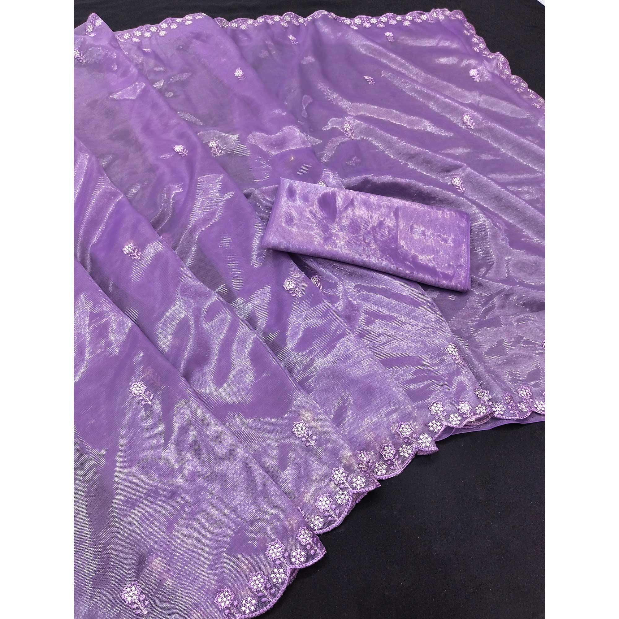 Lavender Net Partywear Saree Featuring Fine Floral Embroidery and a Soft, Flowing Look