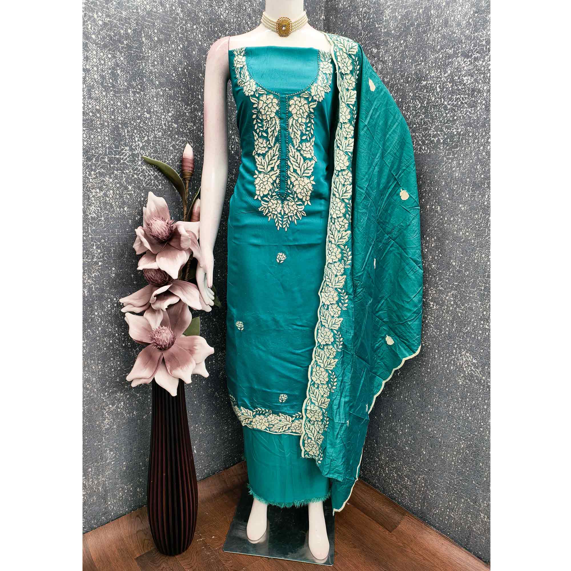 Teal Green Rich Viscose Dress Material Highlighted with Refined Floral Thread Embroidery