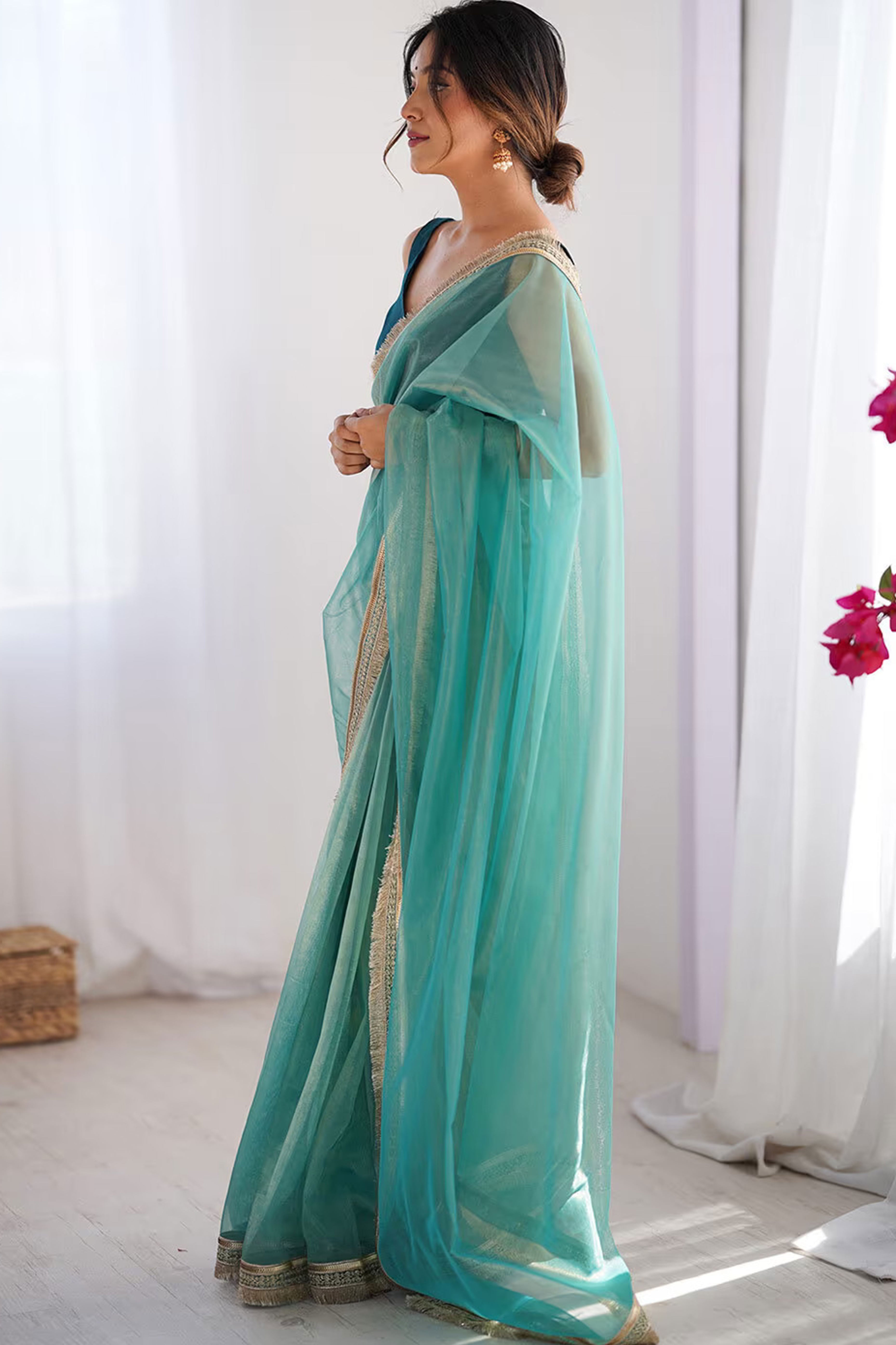 Turquoise Solid Pattern Net Saree with Refined Lace Work for Parties