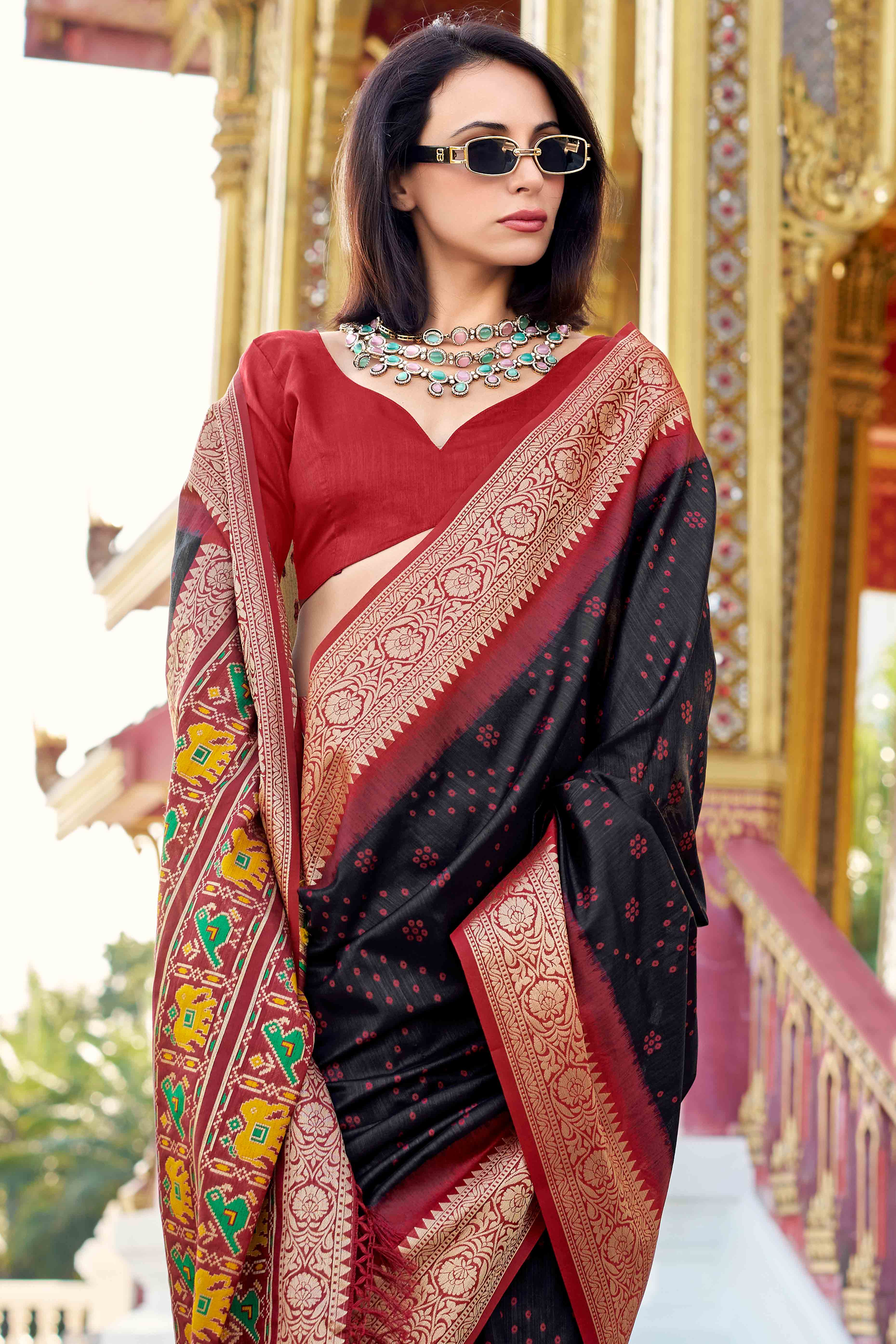 Silk Blend Woven Bandhani Saree In Black With Contrasting Patola Pallu