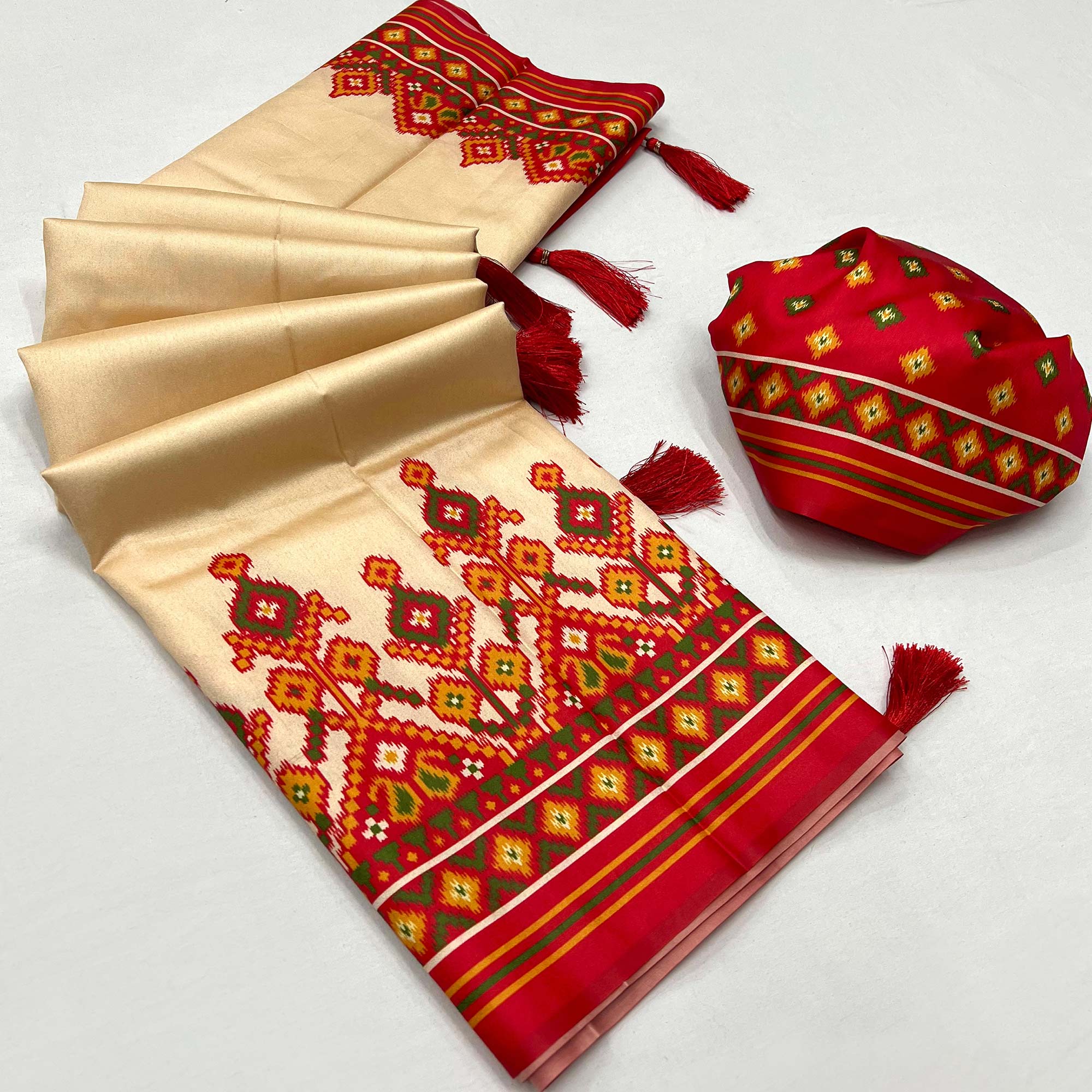 Cream Patola Printed Tussar Silk Saree With Tassels