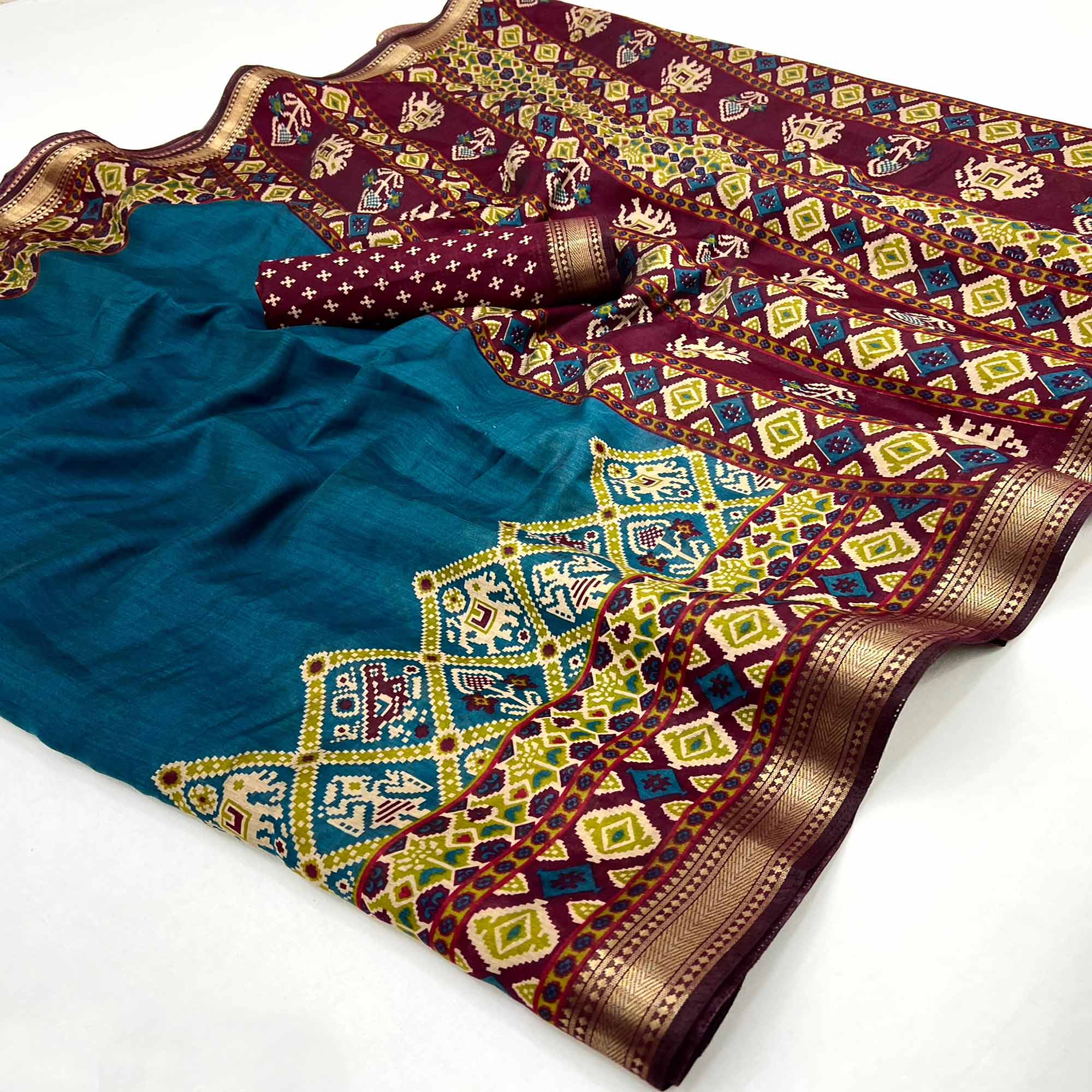 Teal Patola Print Saree in Featherlight Mulmul Cotton with Zari Border
