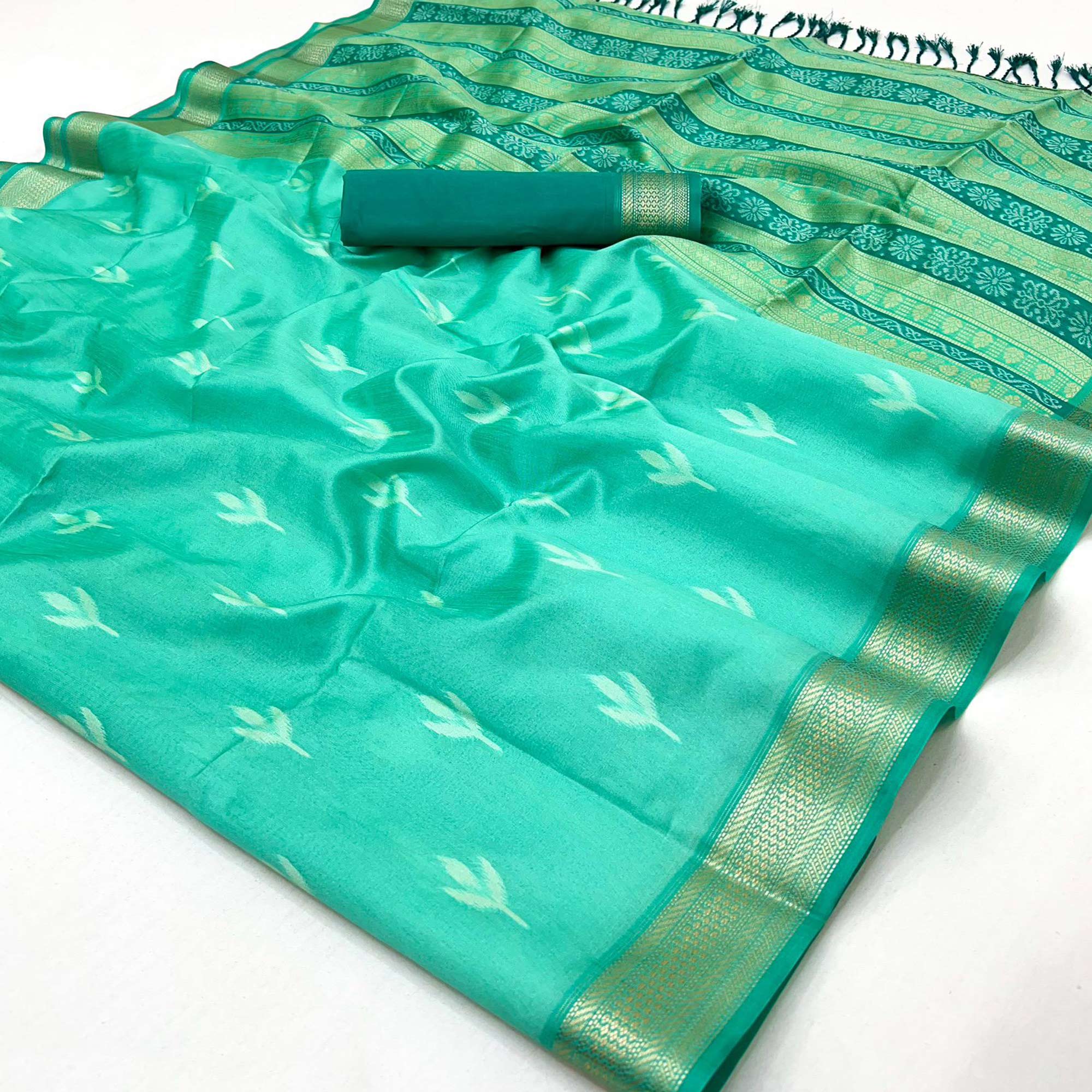 Turquoise Ikkat Style Rayon Silk Saree with Luxurious Zari Border and Delicate Tassels