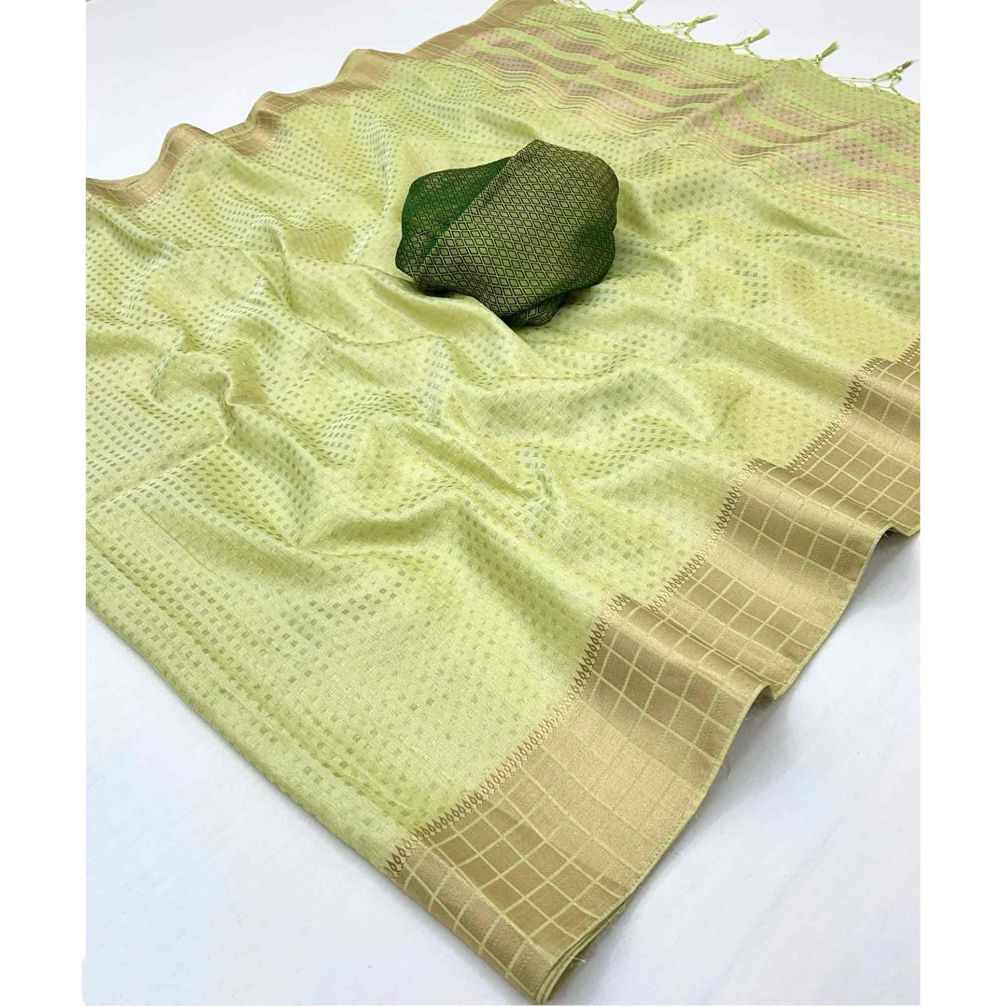 Green Soft Tissue Saree Featuring Rich Zari-Woven Detailing.