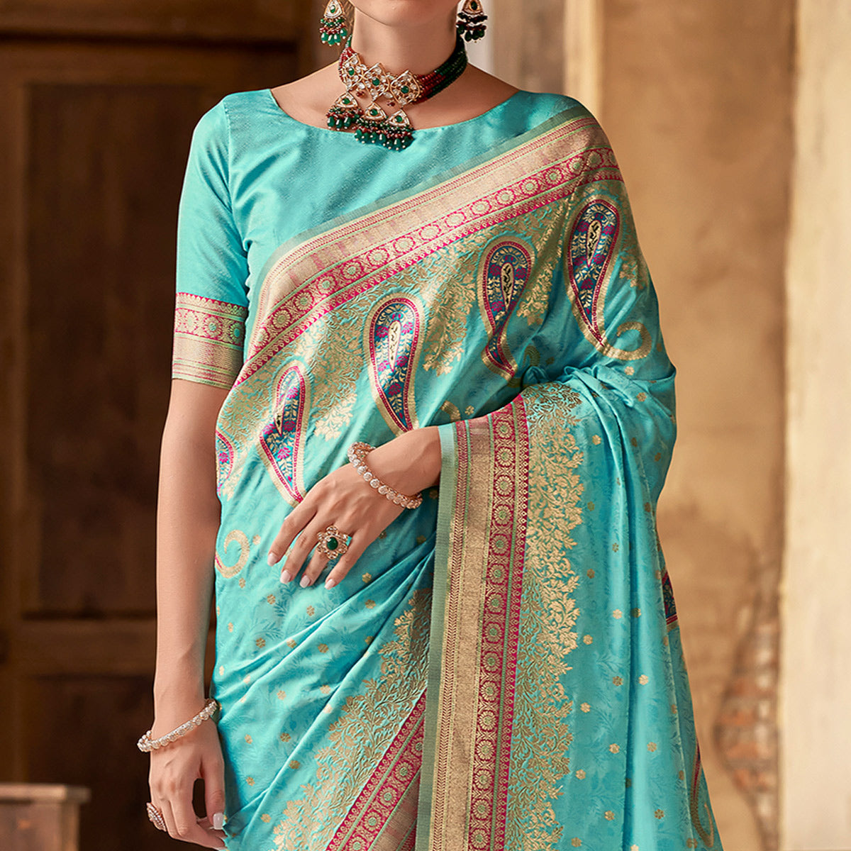 Turquoise Floral Woven Banarasi Silk Saree With Tassels