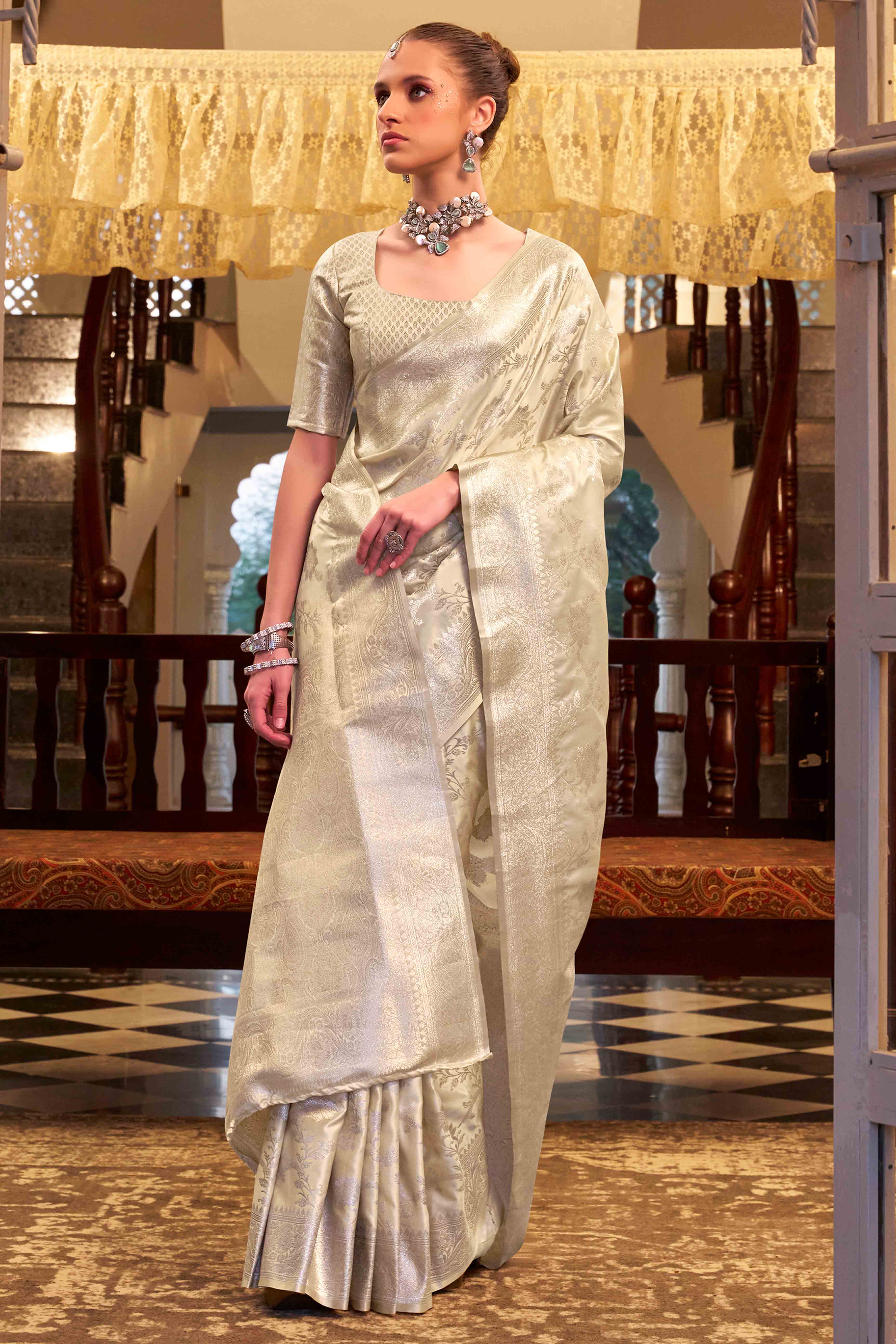 Off White Soft Satin Saree Featuring Exquisite Zari Weaving Work