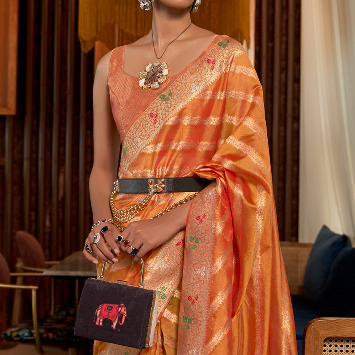 Orange Woven Organza Saree With Tassels