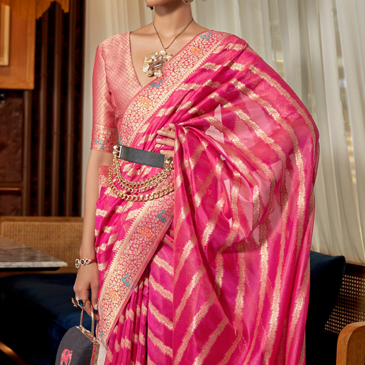 Pink Woven Organza Saree With Tassels