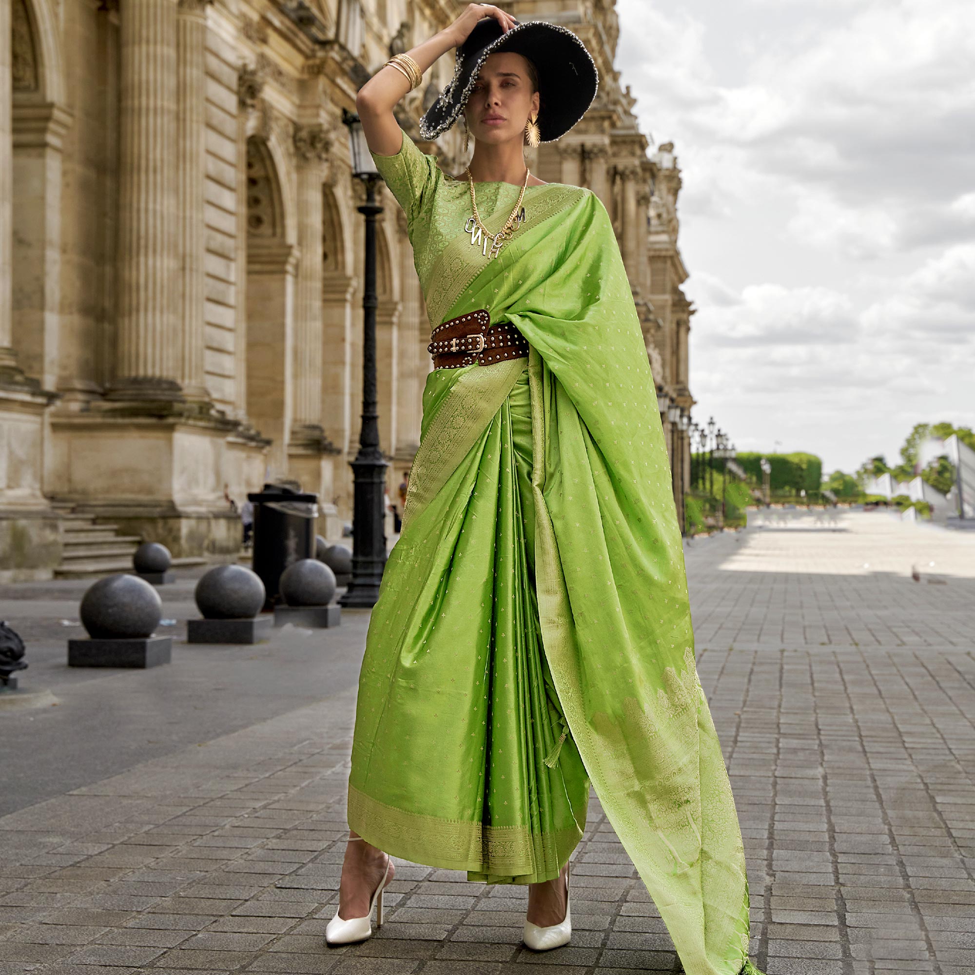 Green Zari Woven Satin Saree With Tassels