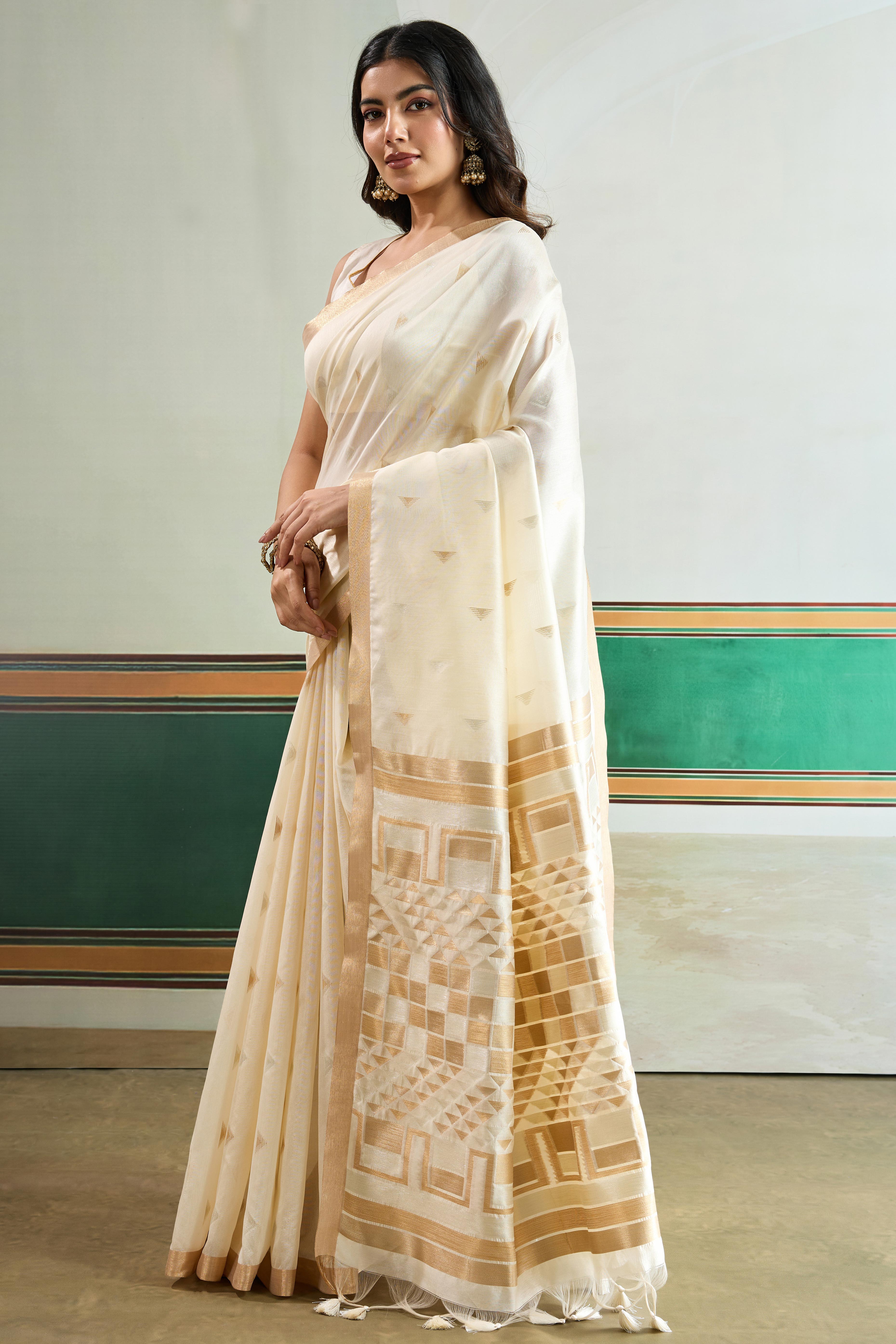 Classic Offwhite Tussar Silk Saree Showcasing Rich Geometric Weaving & Trendy Tassel Pallu