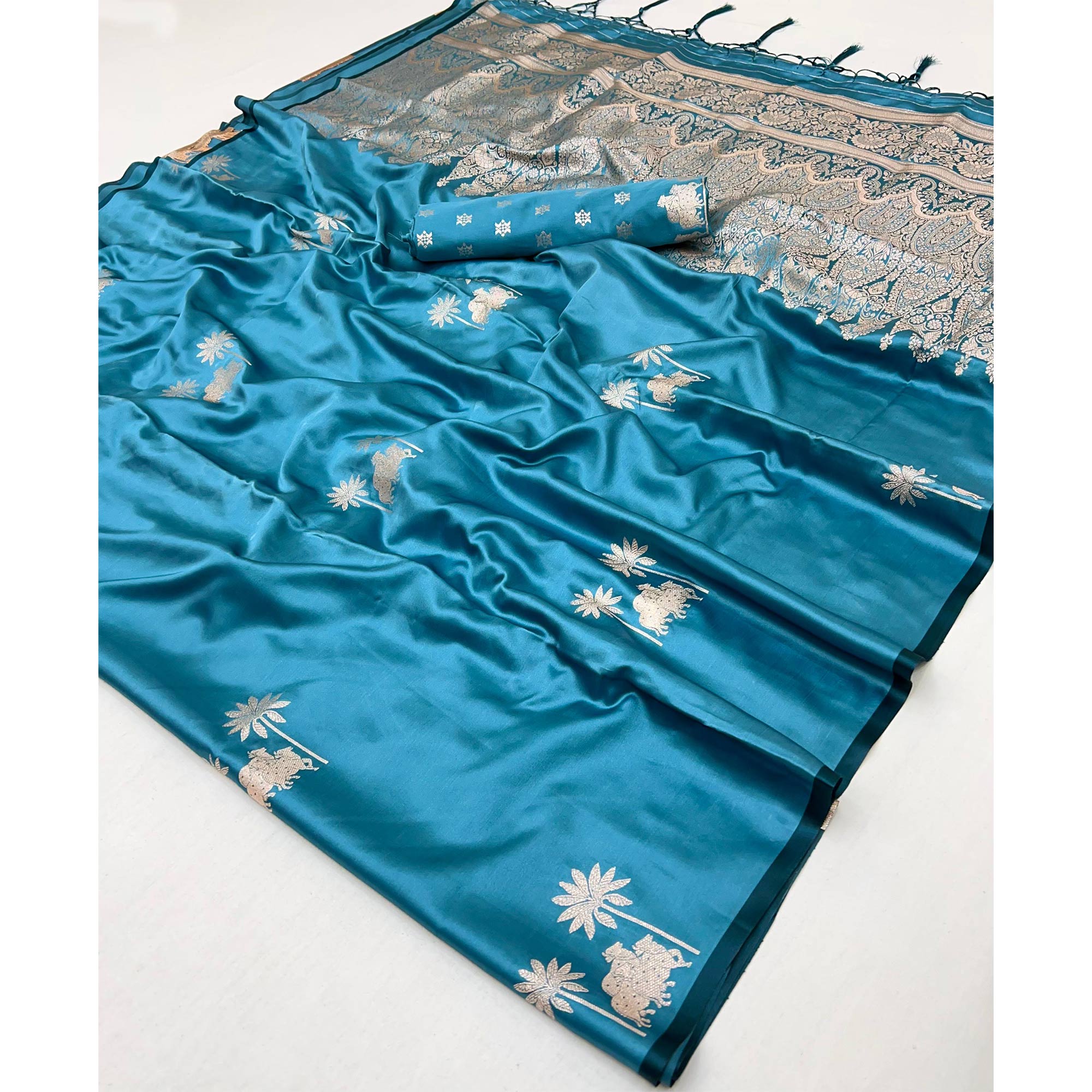 Morpich Blue Satin Silk Saree with Exquisite Floral Zari Weaving & Graceful Tassel Detailing