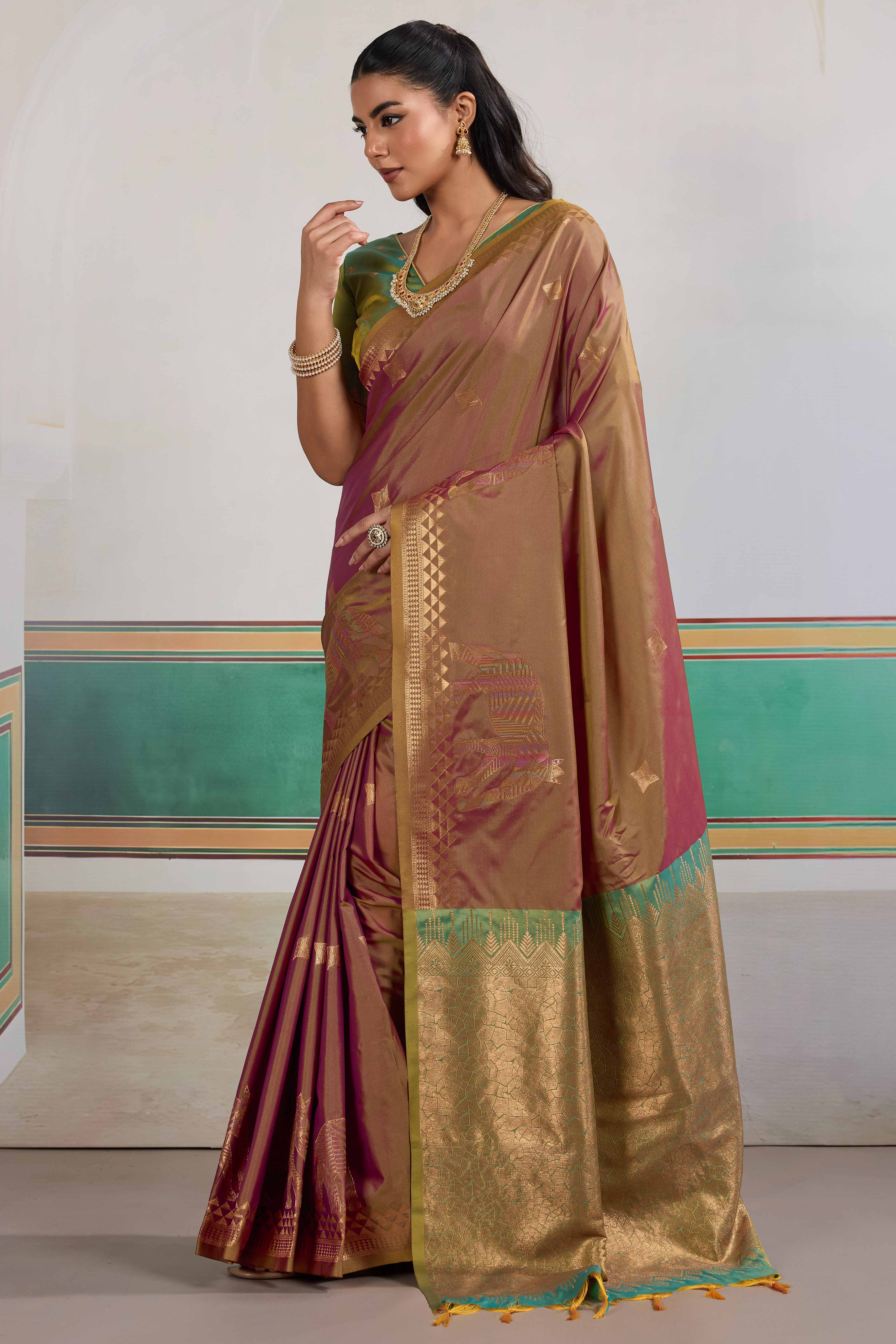 Traditional Brown Pure Silk Saree Featuring Elephant Motif Zari Weaving & Tassel Pallu