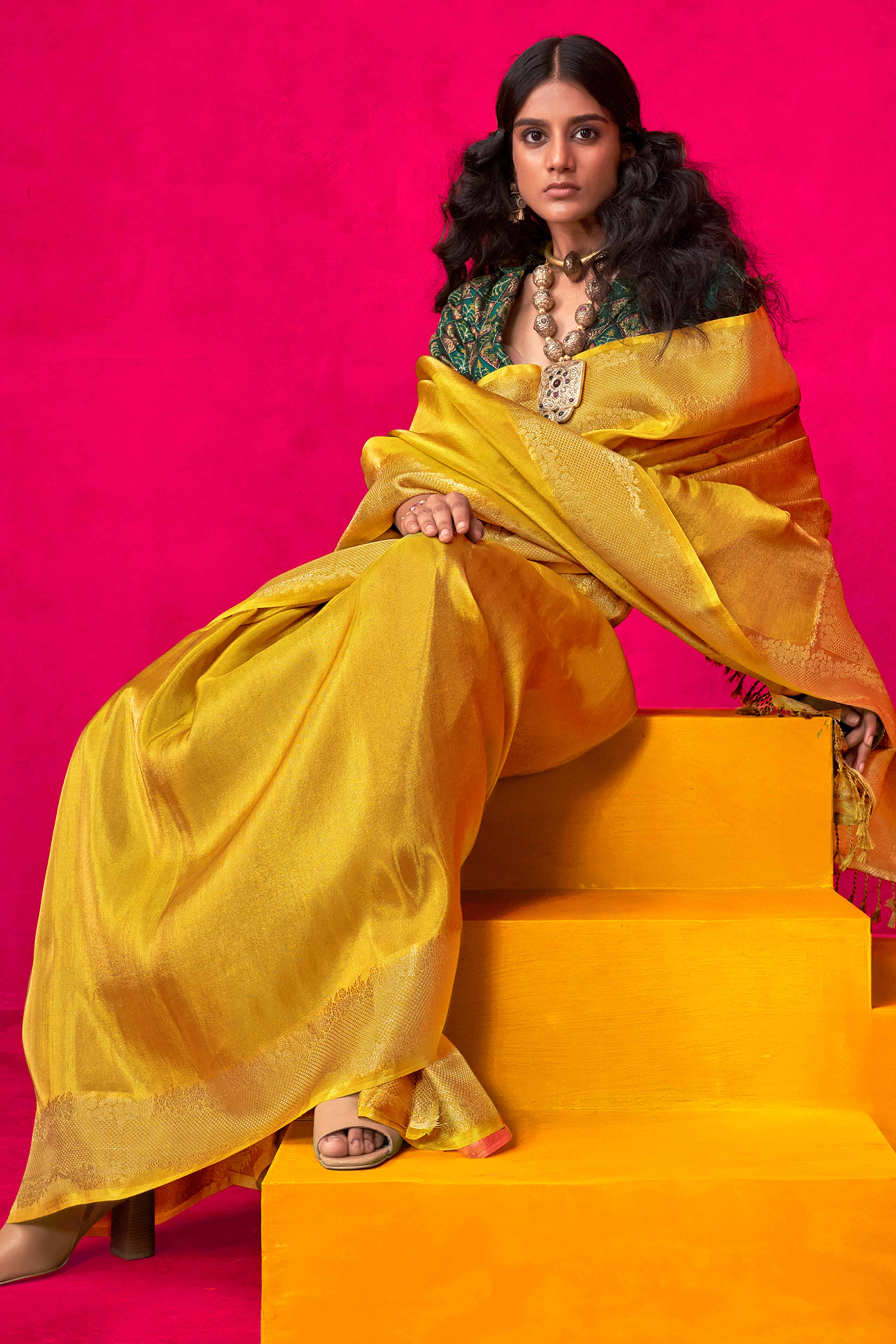Yellow Tissue Saree Adorned with Zari Weaving Border