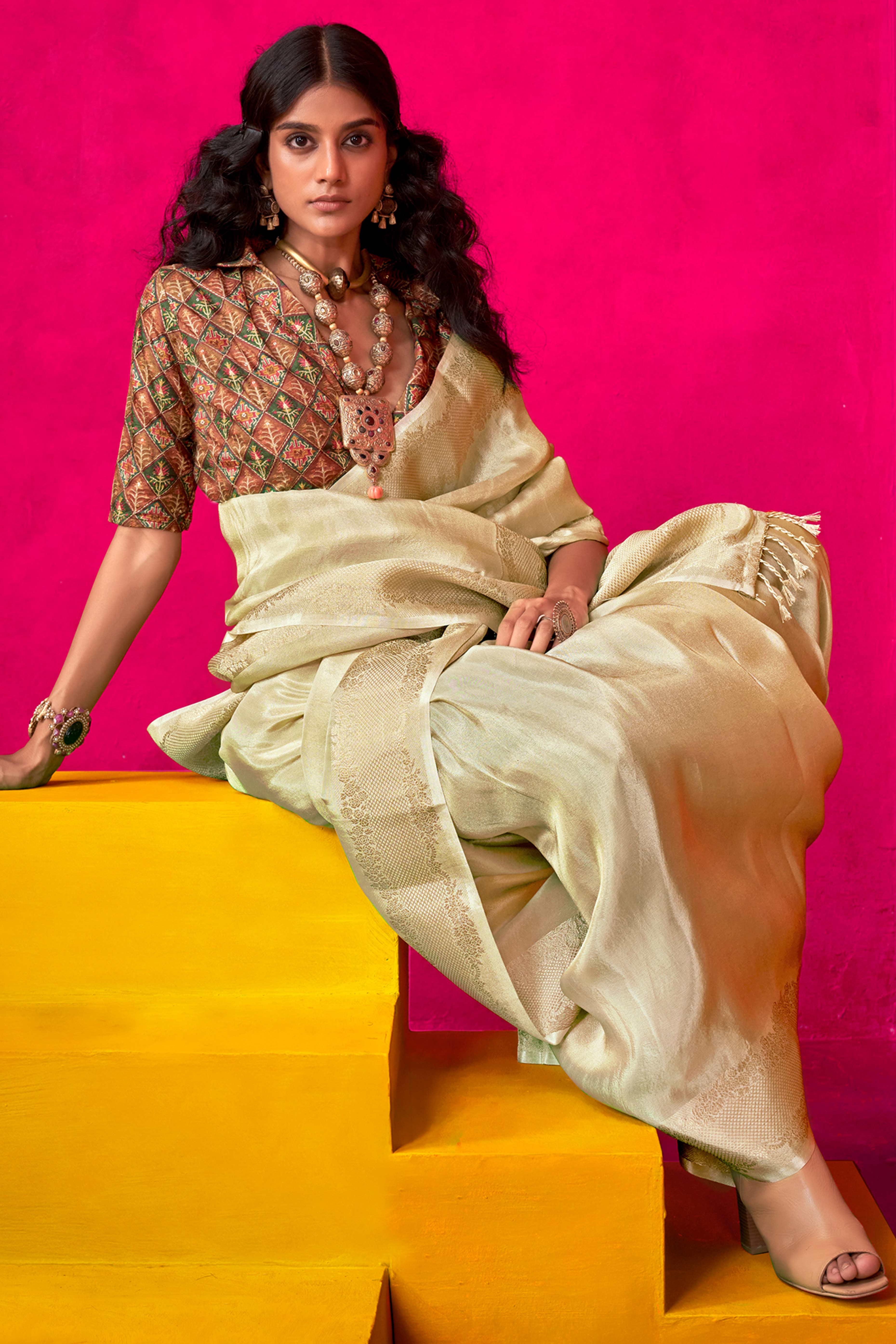 Cream Tissue Saree Adorned with Zari Weaving Border