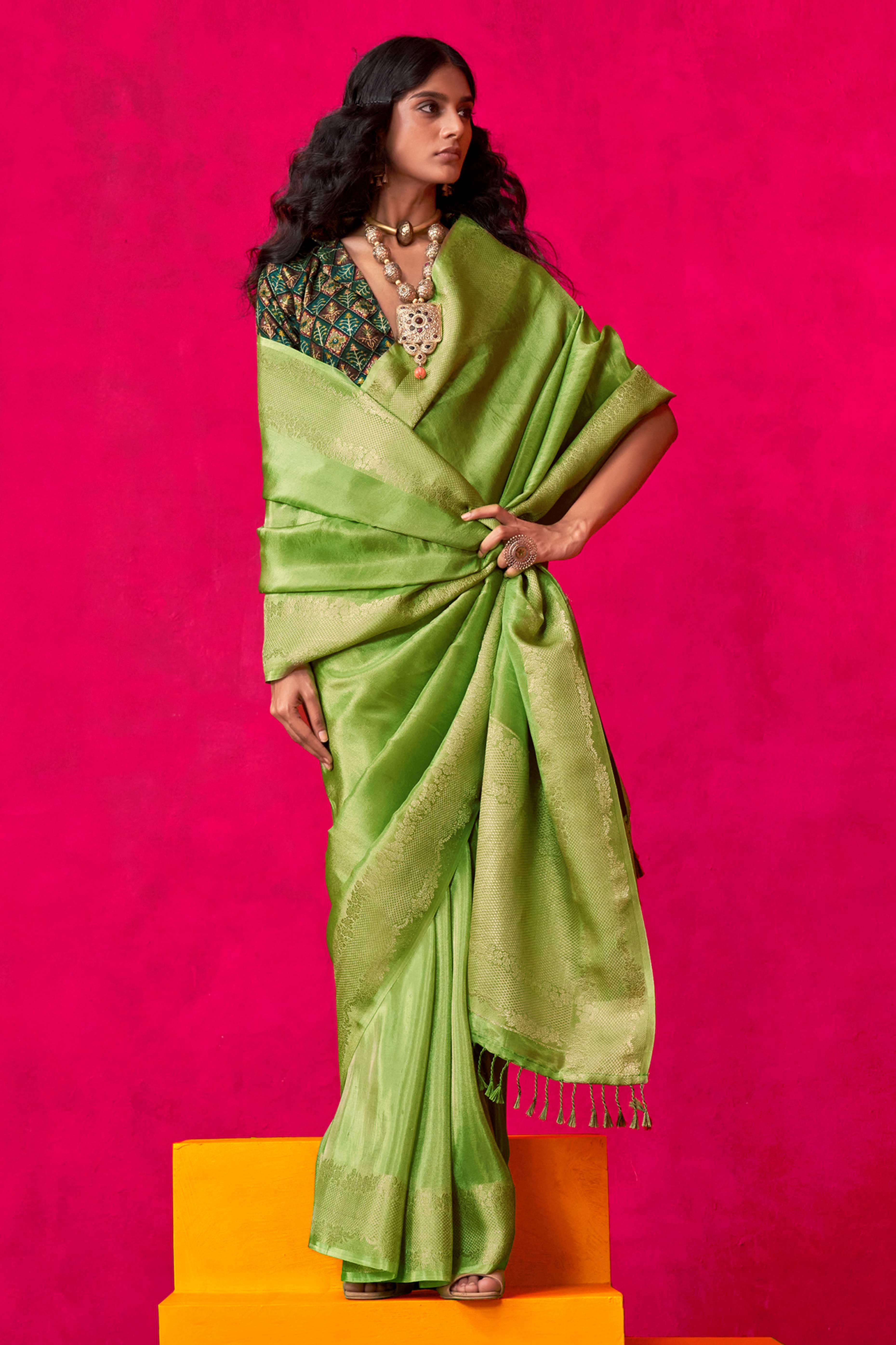 Green Tissue Saree Adorned with Zari Weaving Border