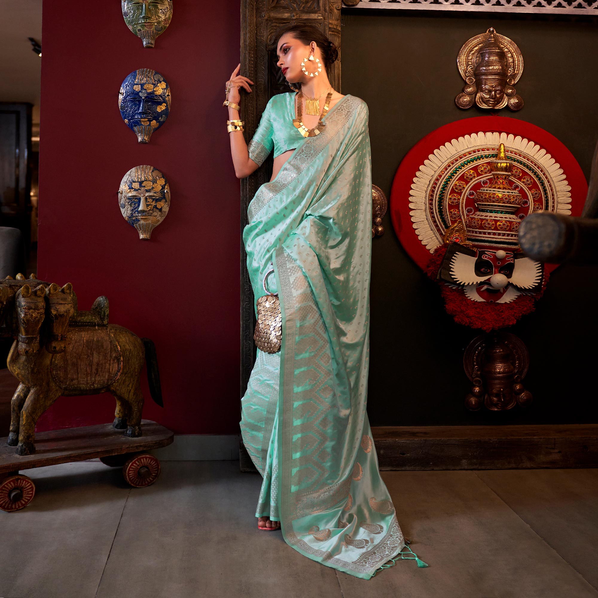 Sea Green Woven Satin Saree With Tassels