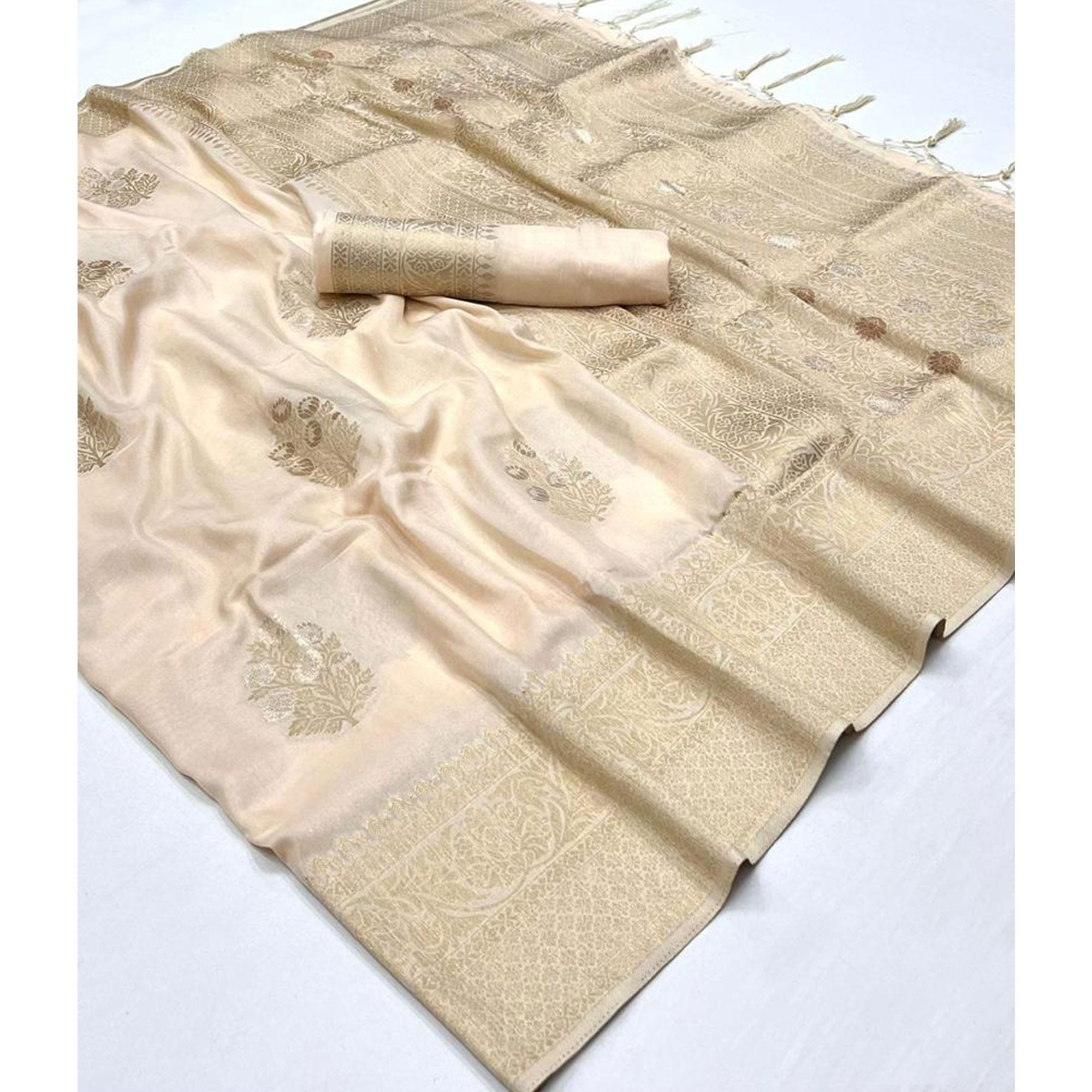 Cream Woven Georgette Saree With Tassels