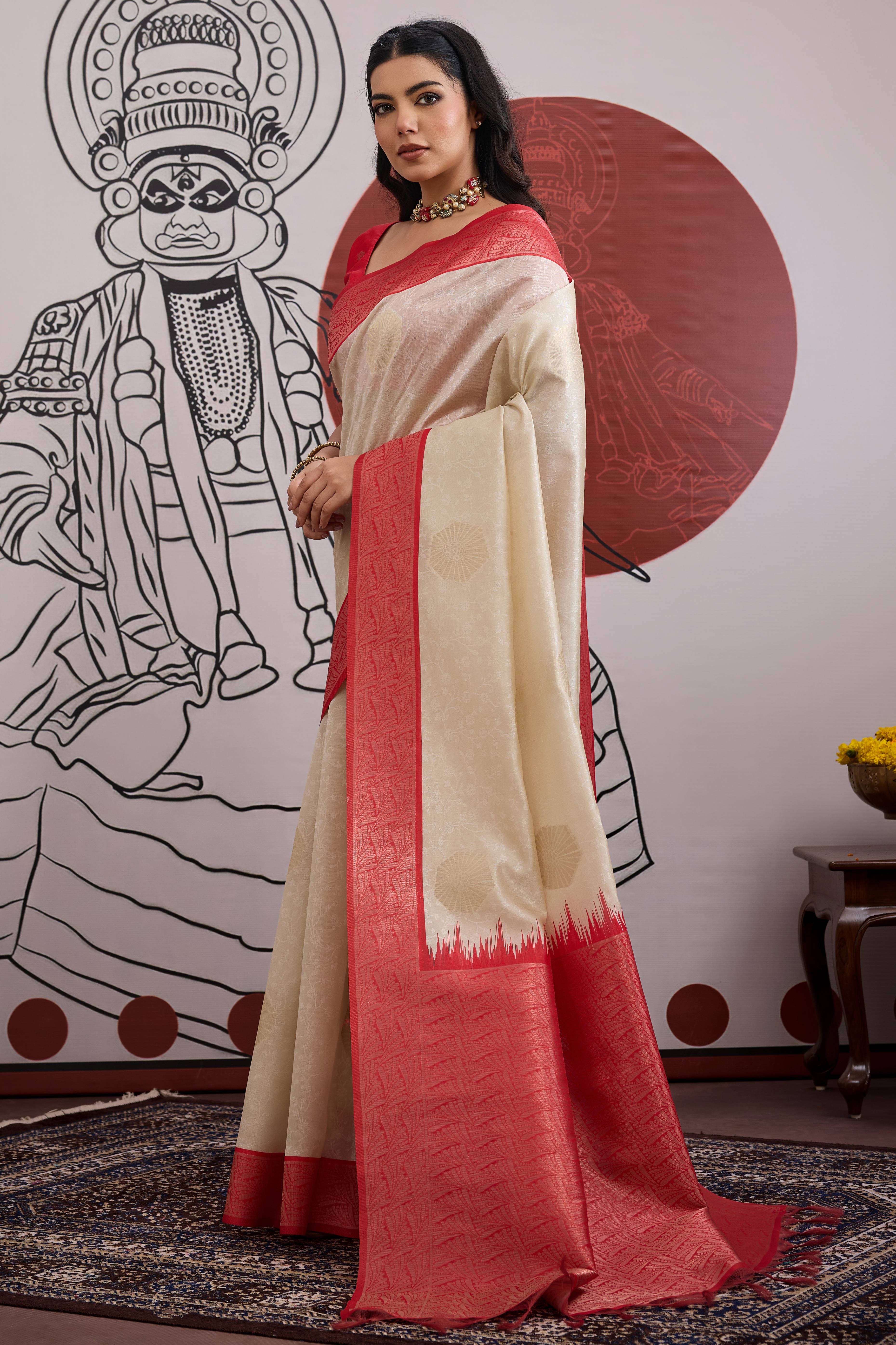 Graceful Cream & Red Zari Weaving Silk Saree Highlighted By Decorative Tassel Pallu