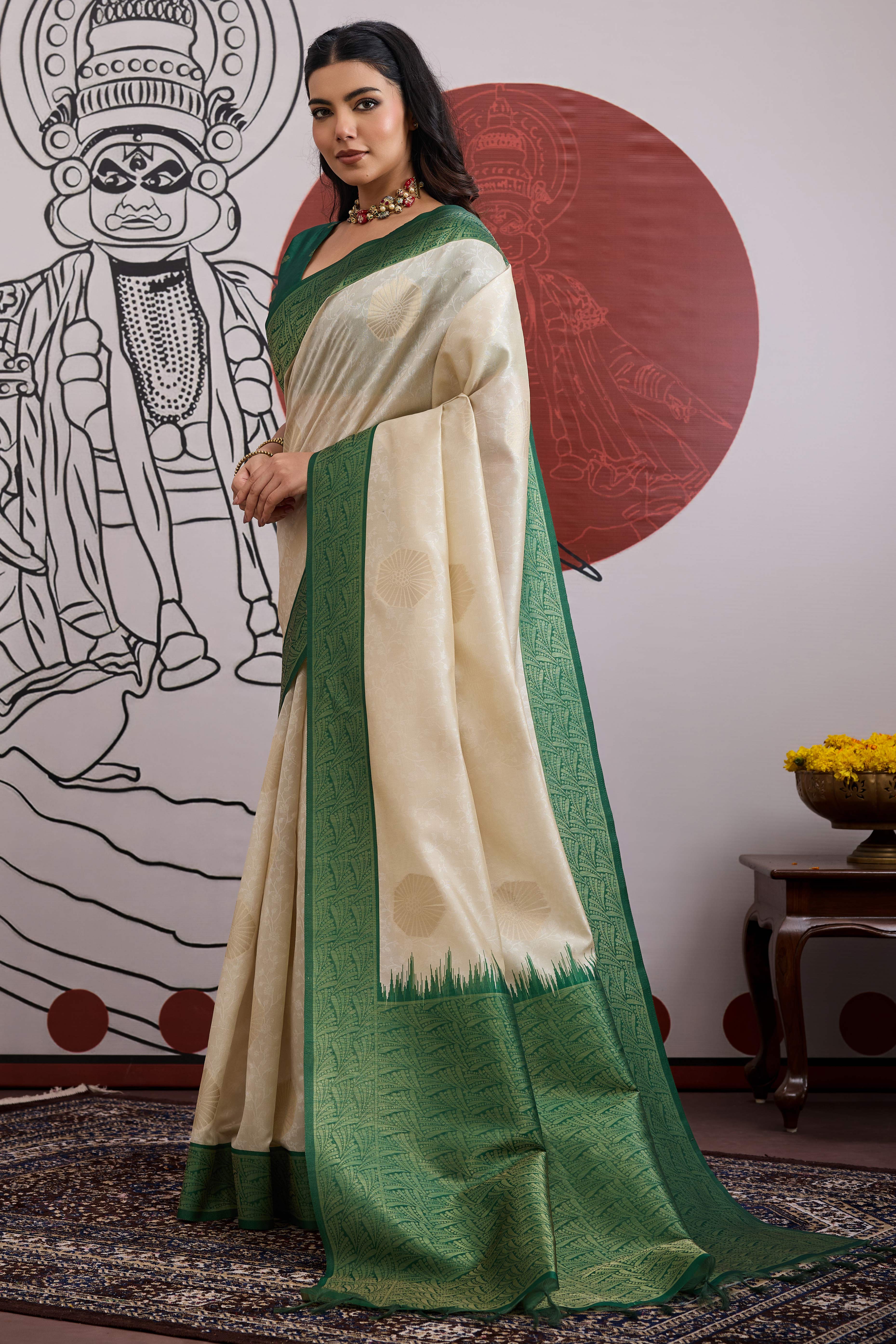 Graceful Cream & Green Zari Weaving Silk Saree Highlighted By Decorative Tassel Pallu