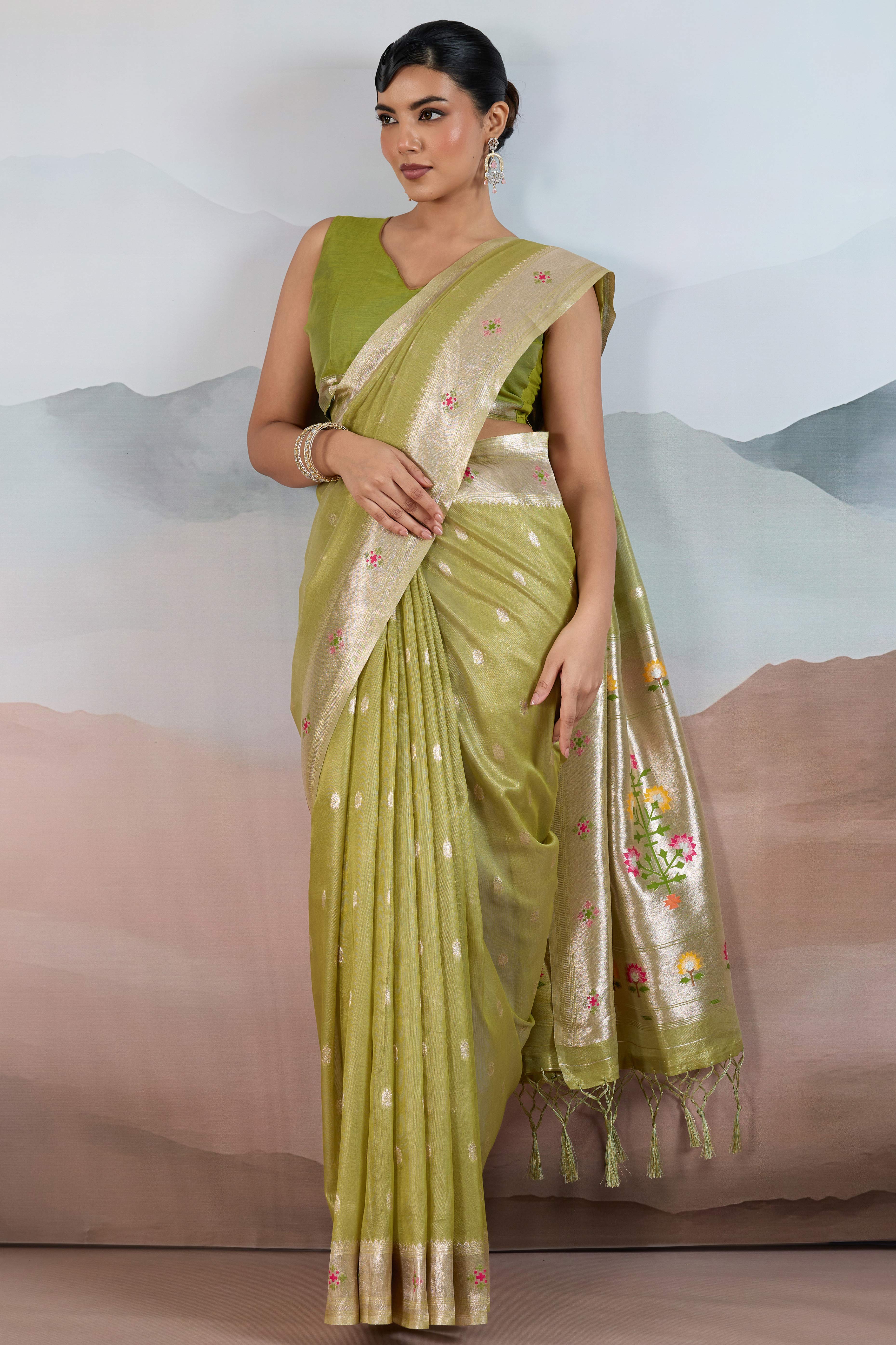 Green Festive Tissue Saree Crafted with Artistic Zari Butti Weaving and a Featherlight Texture