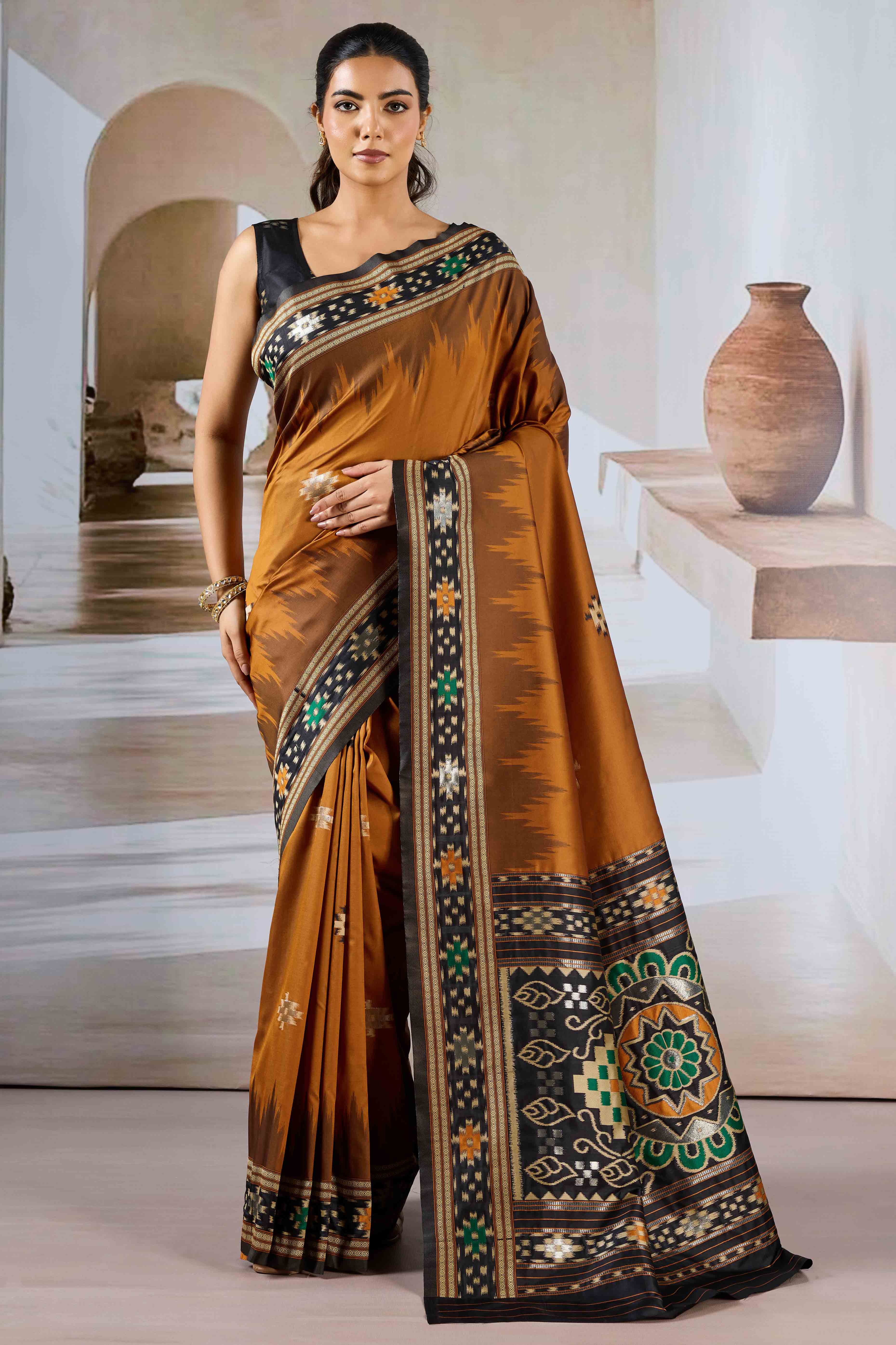 Brown Art Silk Saree Adorned with Intricate Patola Style Woven Designs