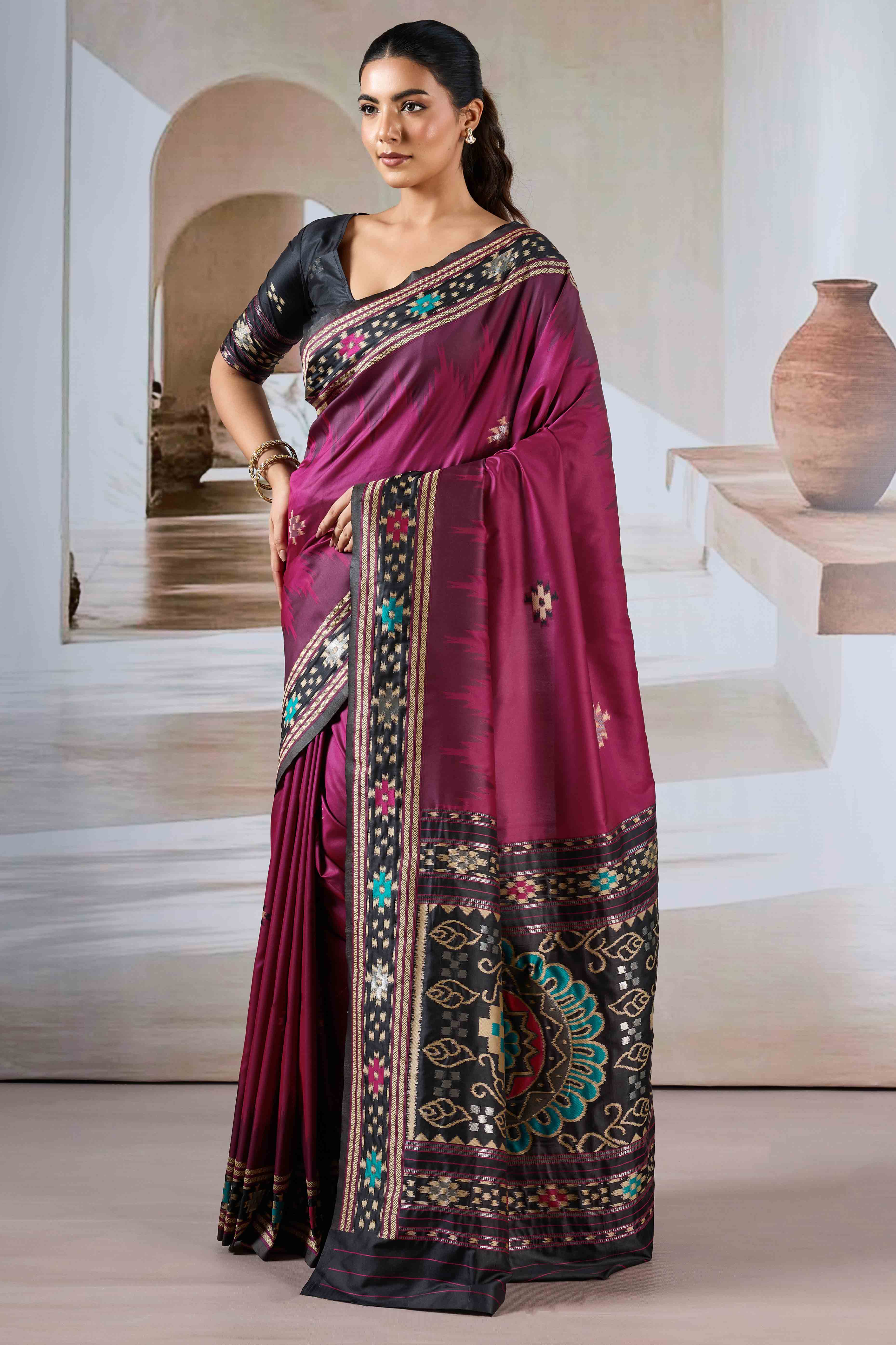 Magenta Art Silk Saree Adorned with Intricate Patola Style Woven Designs
