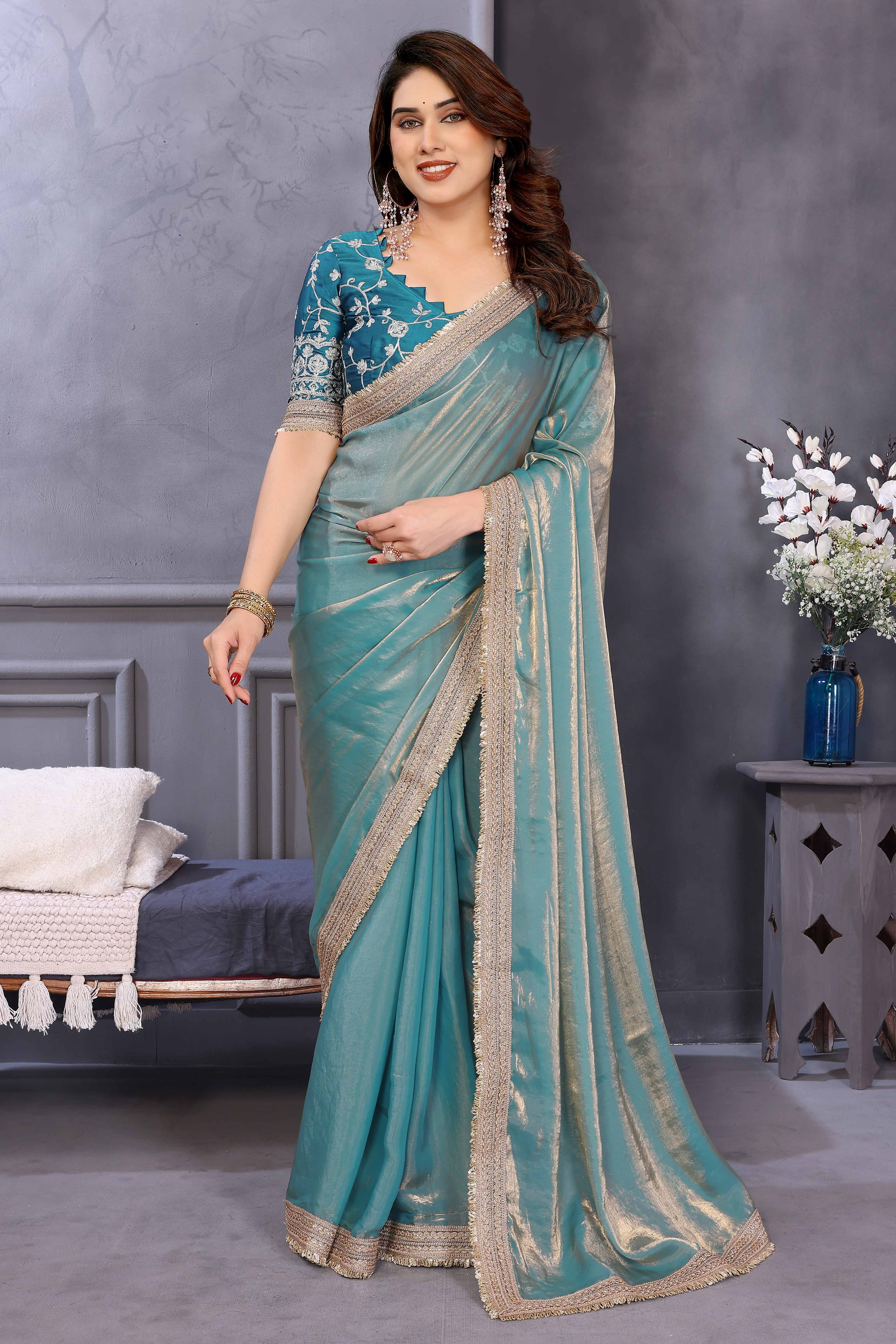 Teal Satin Saree with Solid Body and Decorative Lace Embellished Border – A Modern Ethnic Staple