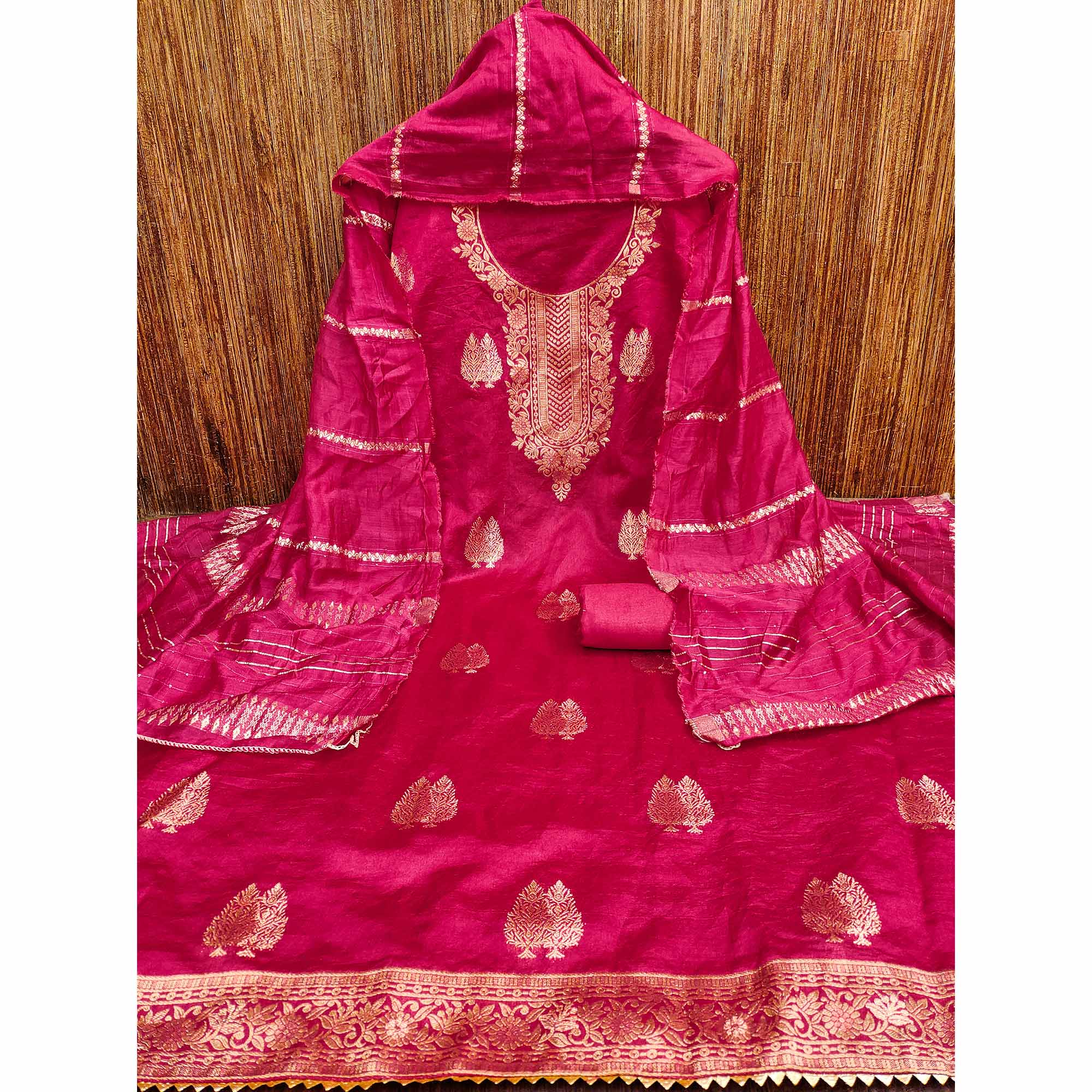 Redefine Elegance with this Rani Pink Floral Woven Banarasi Jacquard Dress Material