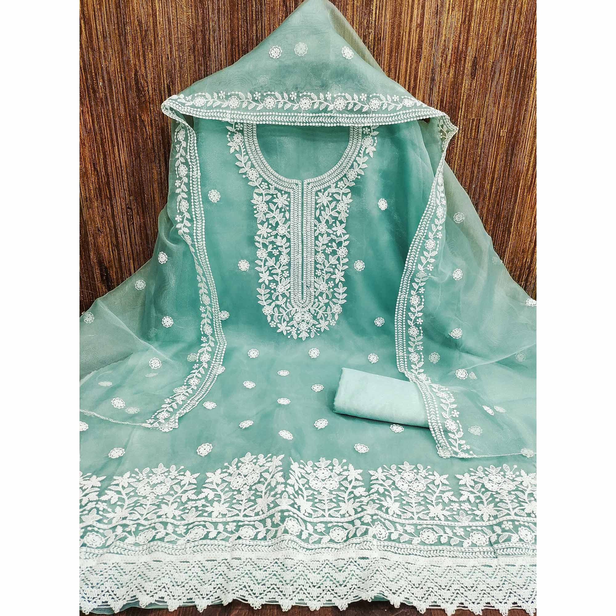 Unleash Your Style With This Turquoise Floral Thread Embroidered Organza Dress Material