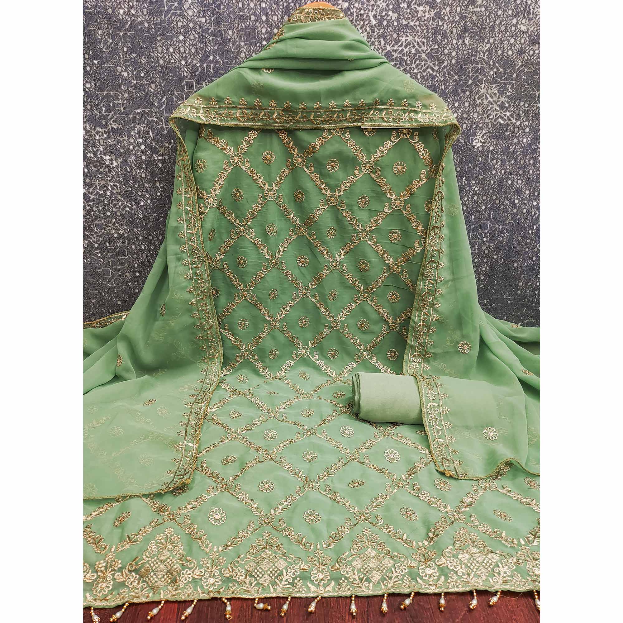 Green Georgette Dress Material Adorned With Floral Zari Embroidery Work