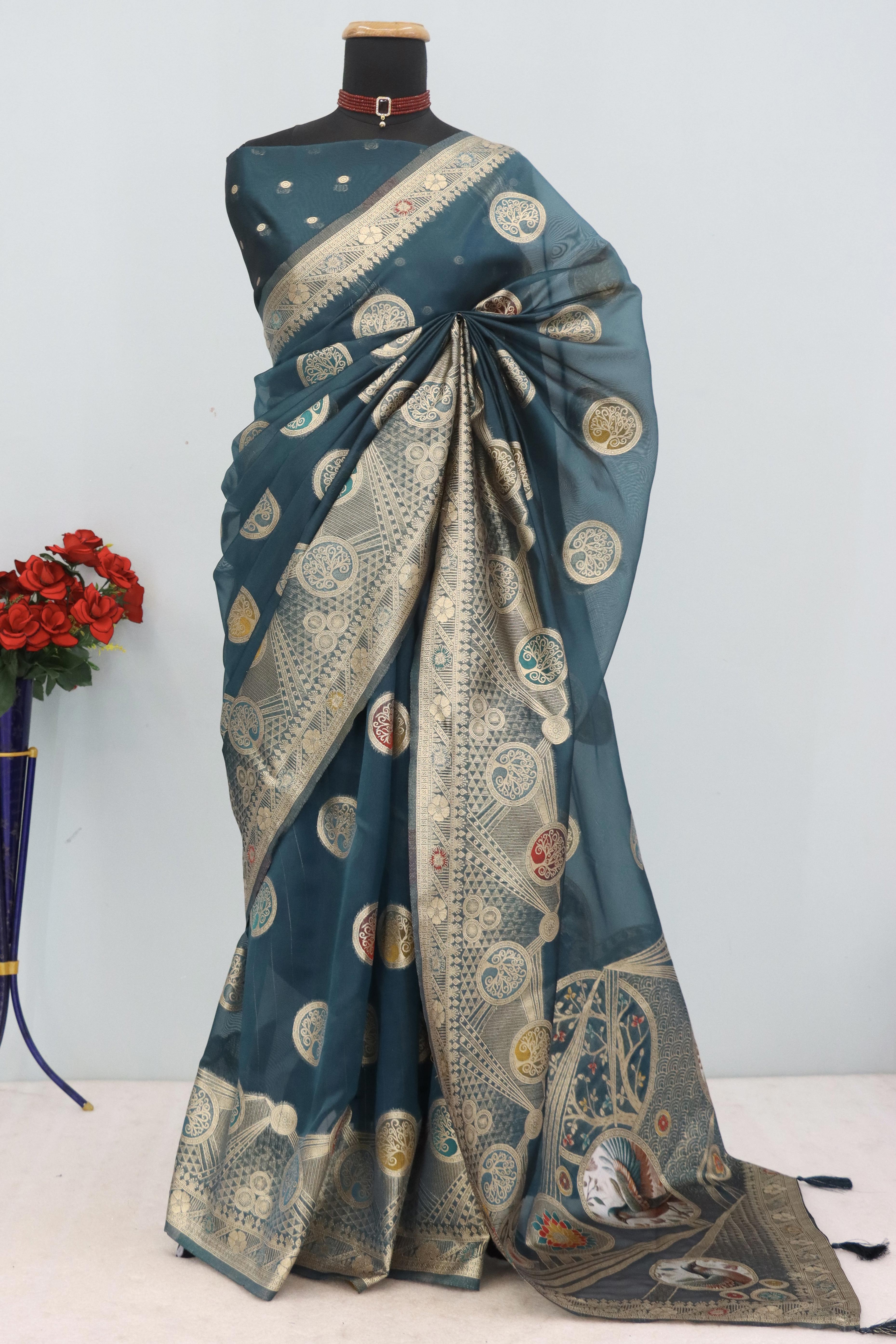 Charming Morpich Blue Zari Woven Floral Organza Saree Accented With Digital Printed Pallu & Latkan