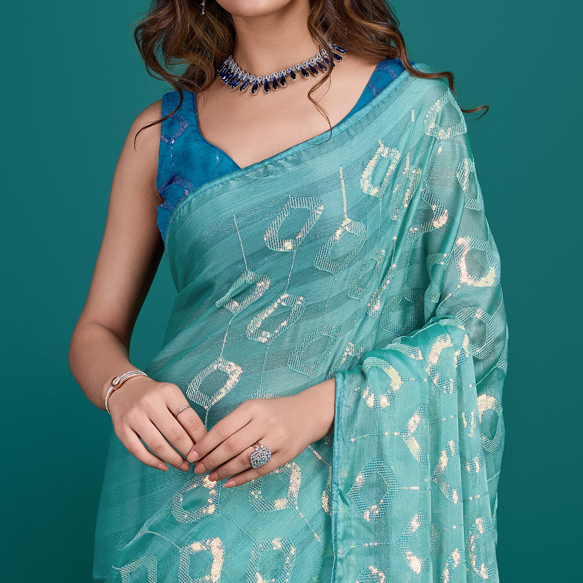 Turquoise Sequin Embroidered Georgette Saree