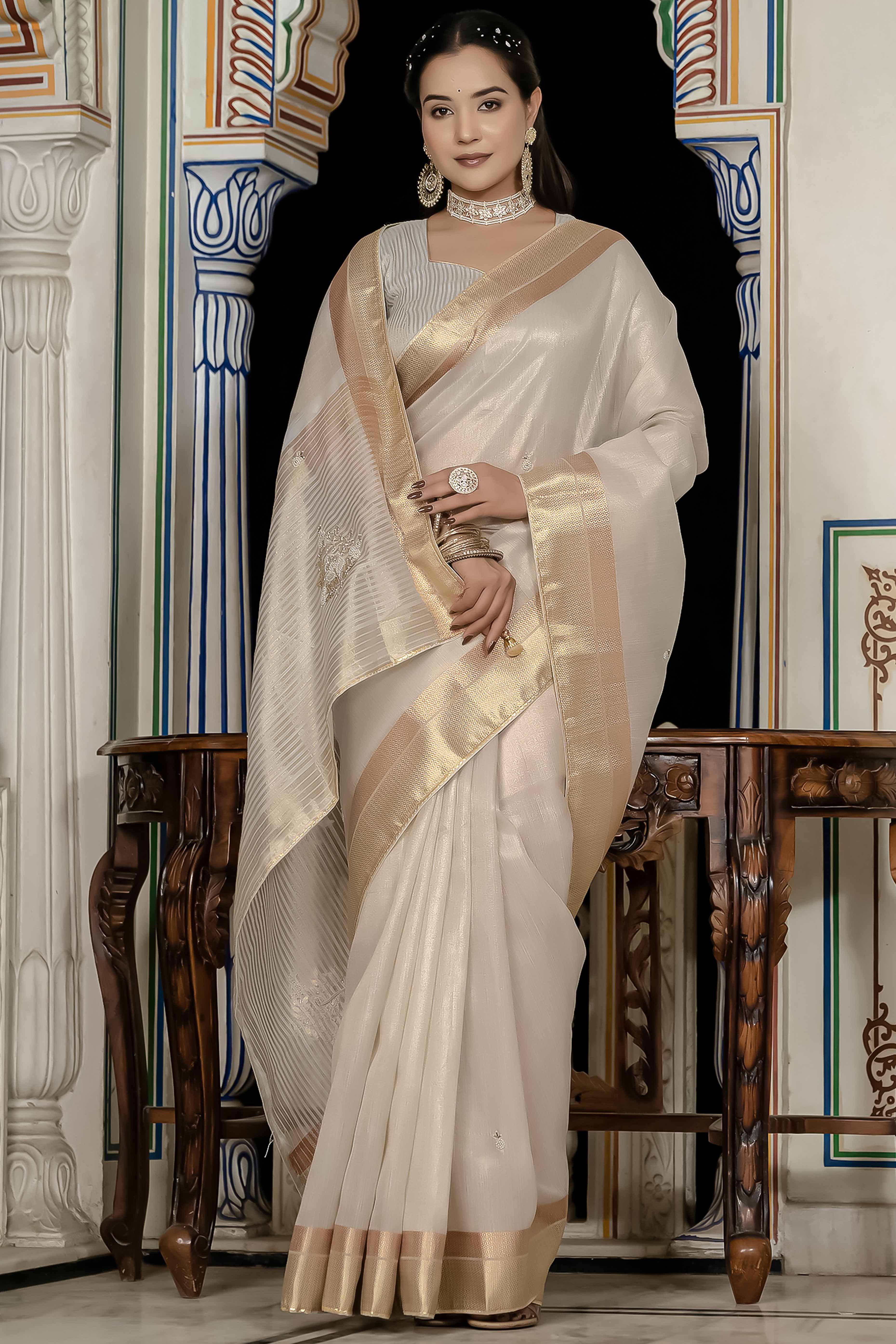 Off White Tissue Linen Saree Featuring Intricate Zari and Beadwork