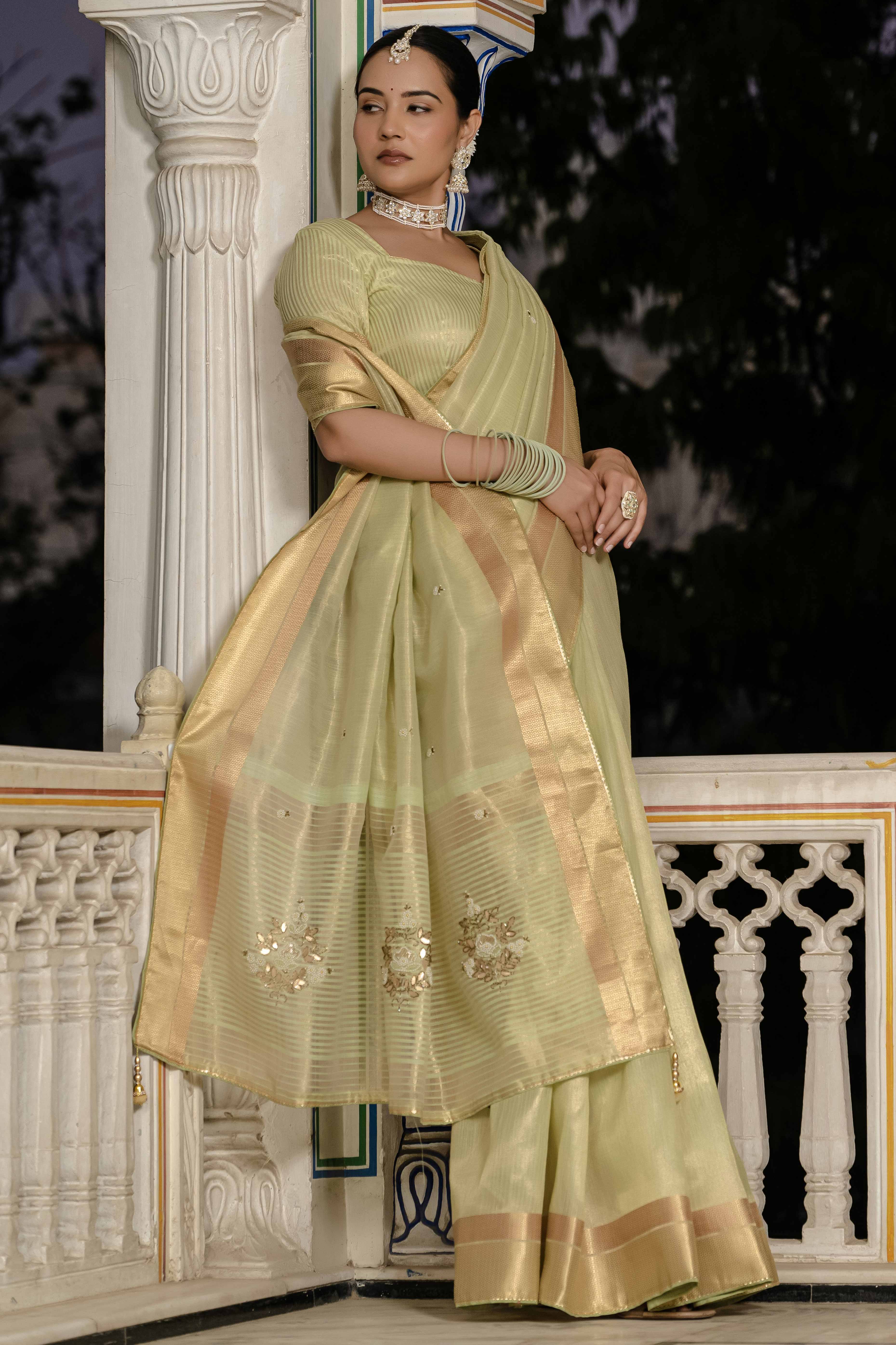 Green Tissue Linen Saree Featuring Intricate Zari and Beadwork