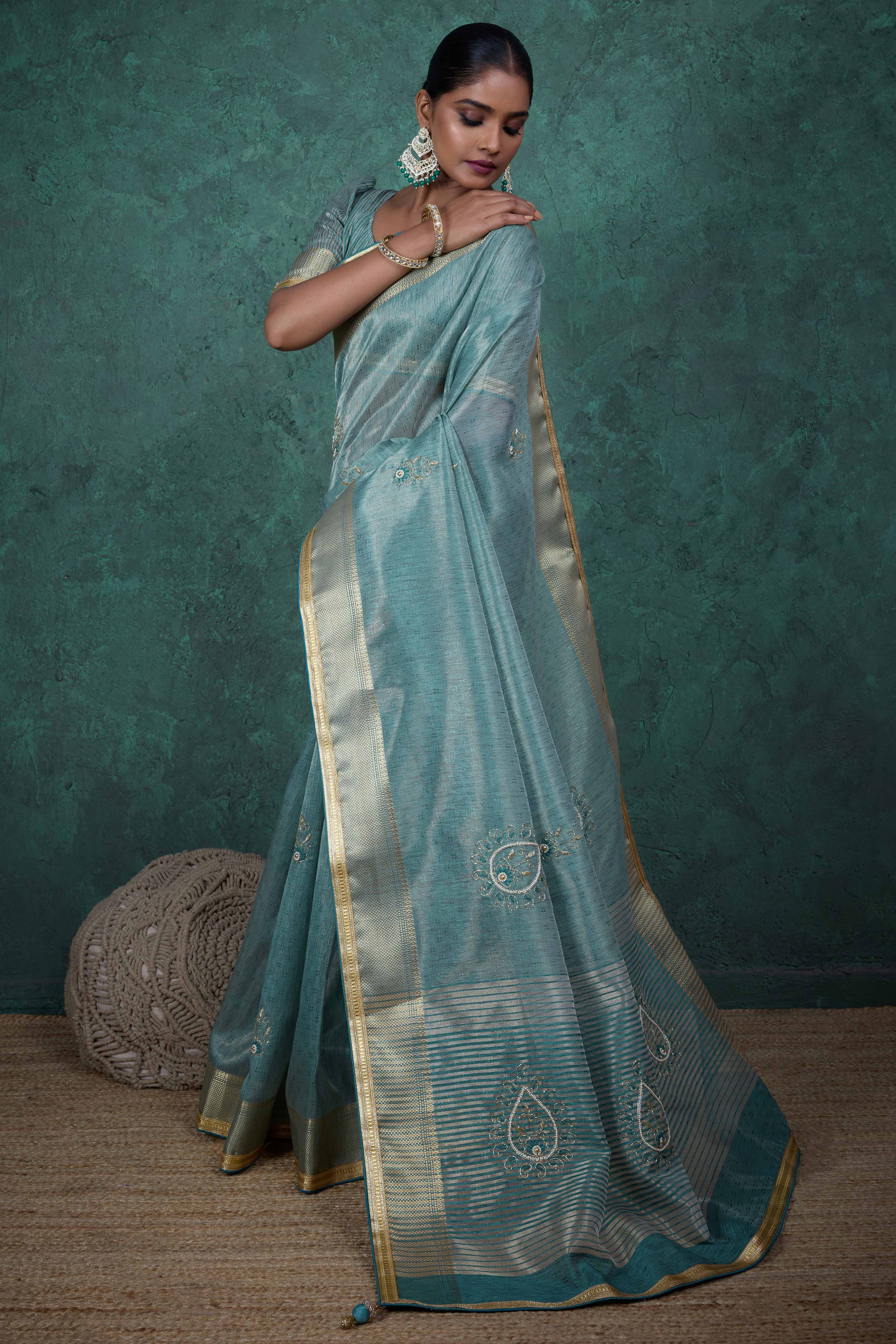 Teal Woven Linen Tissue Saree Featuring Beads Embellishment