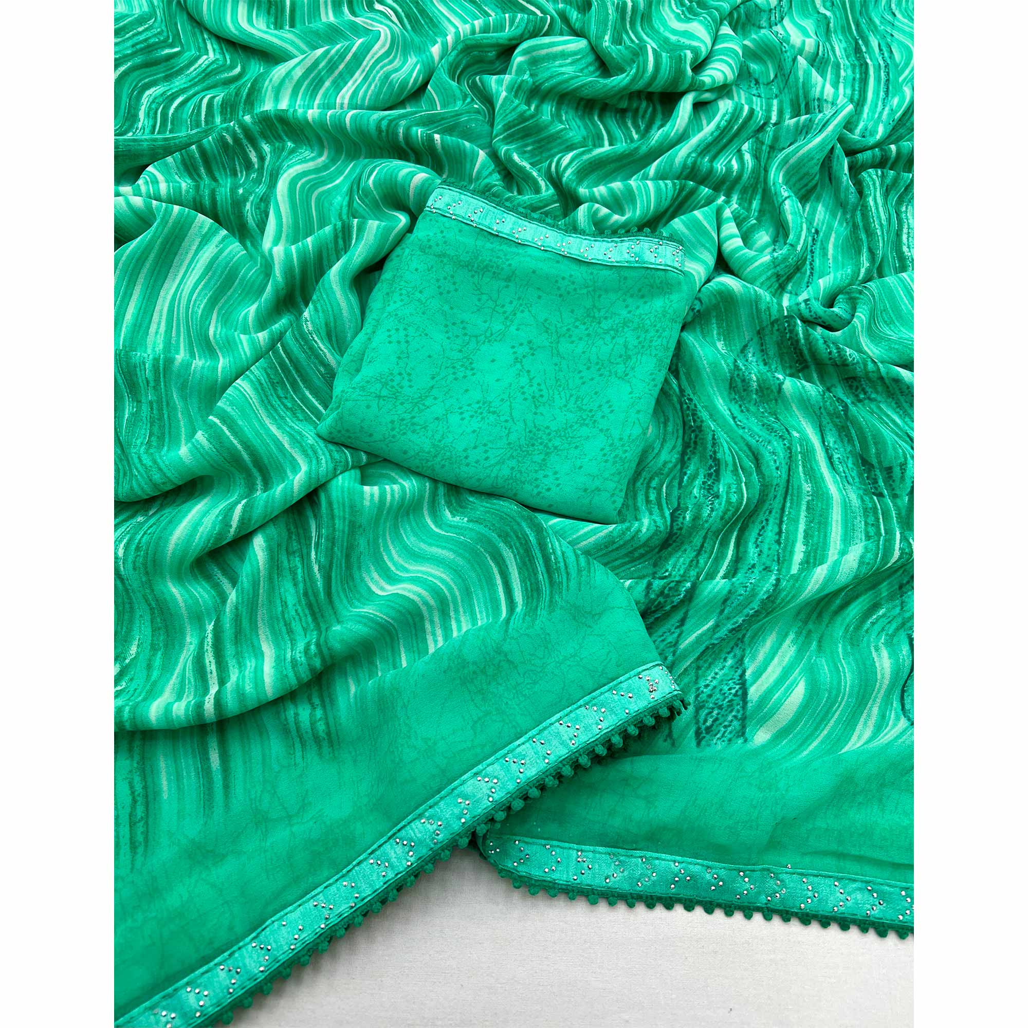 Rama Green Printed Georgette Saree With Fancy Lace Border