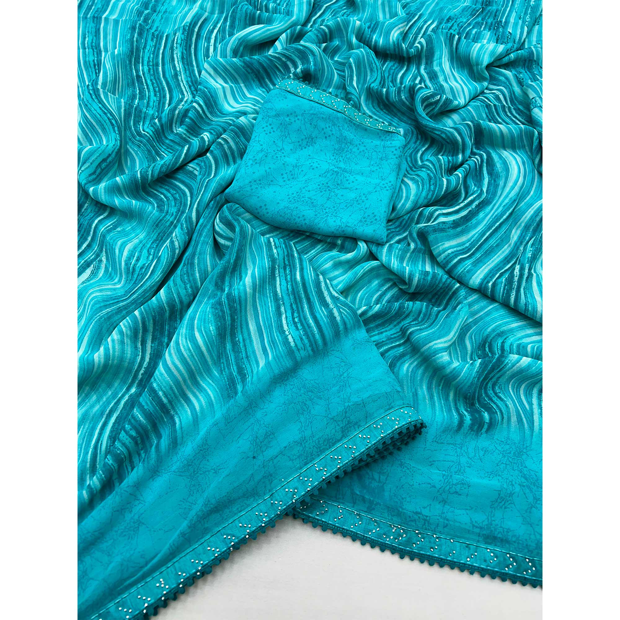 Blue Printed Georgette Saree With Fancy Lace Border