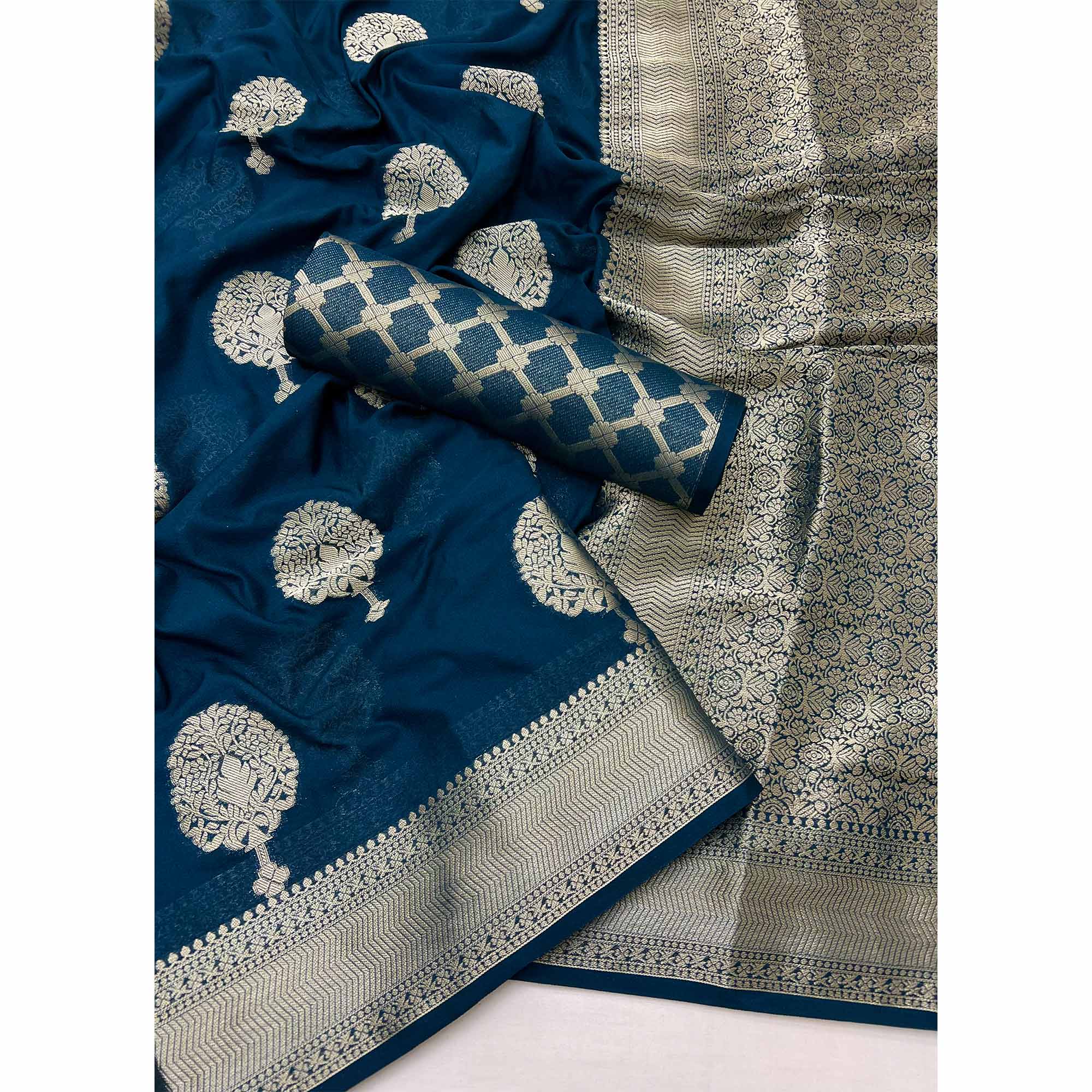 Dark Teal Blue Crepe Silk Saree Featuring Floral Zari Weave & Graceful Tassel Pallu