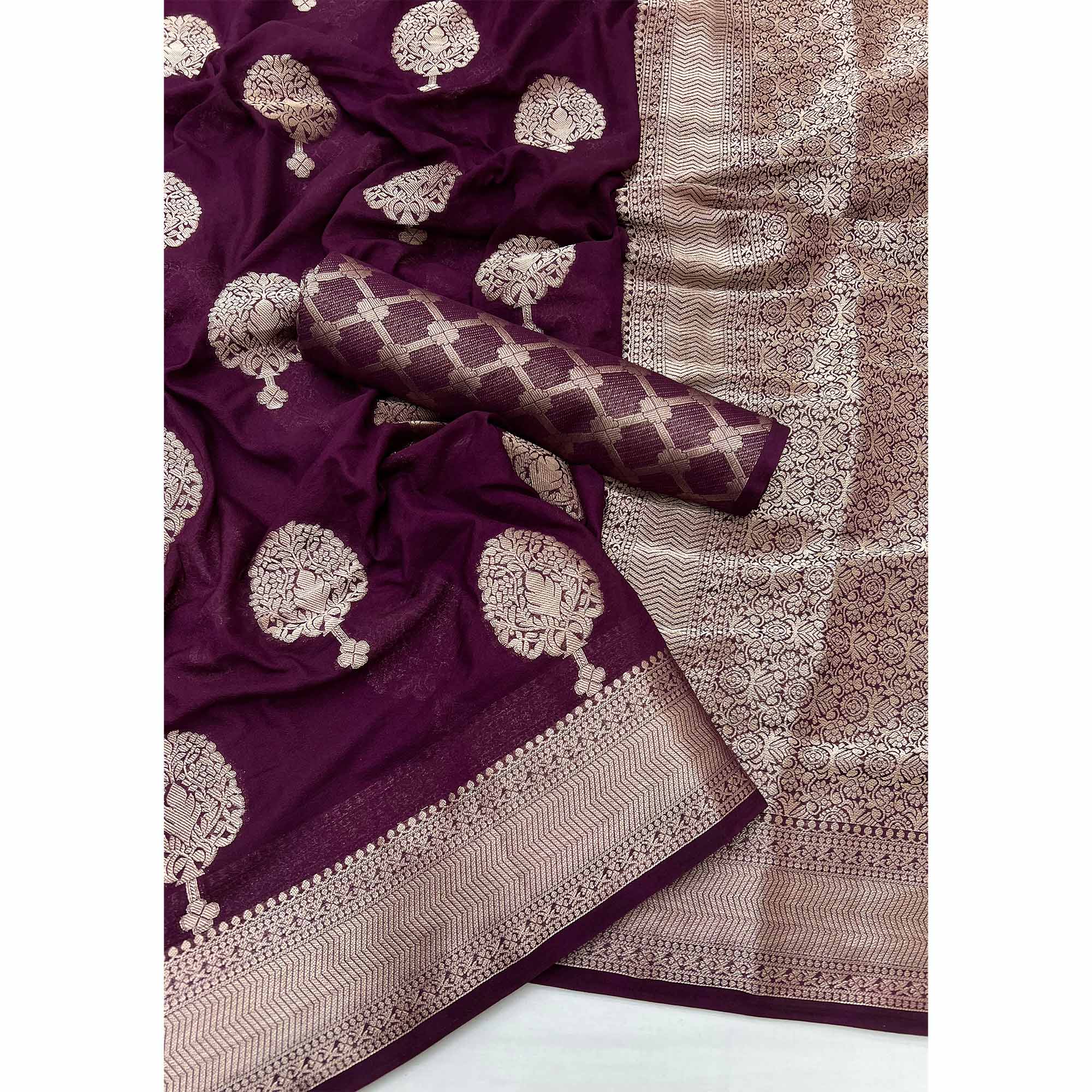 Wine Crepe Silk Saree Featuring Floral Zari Weave & Graceful Tassel Pallu