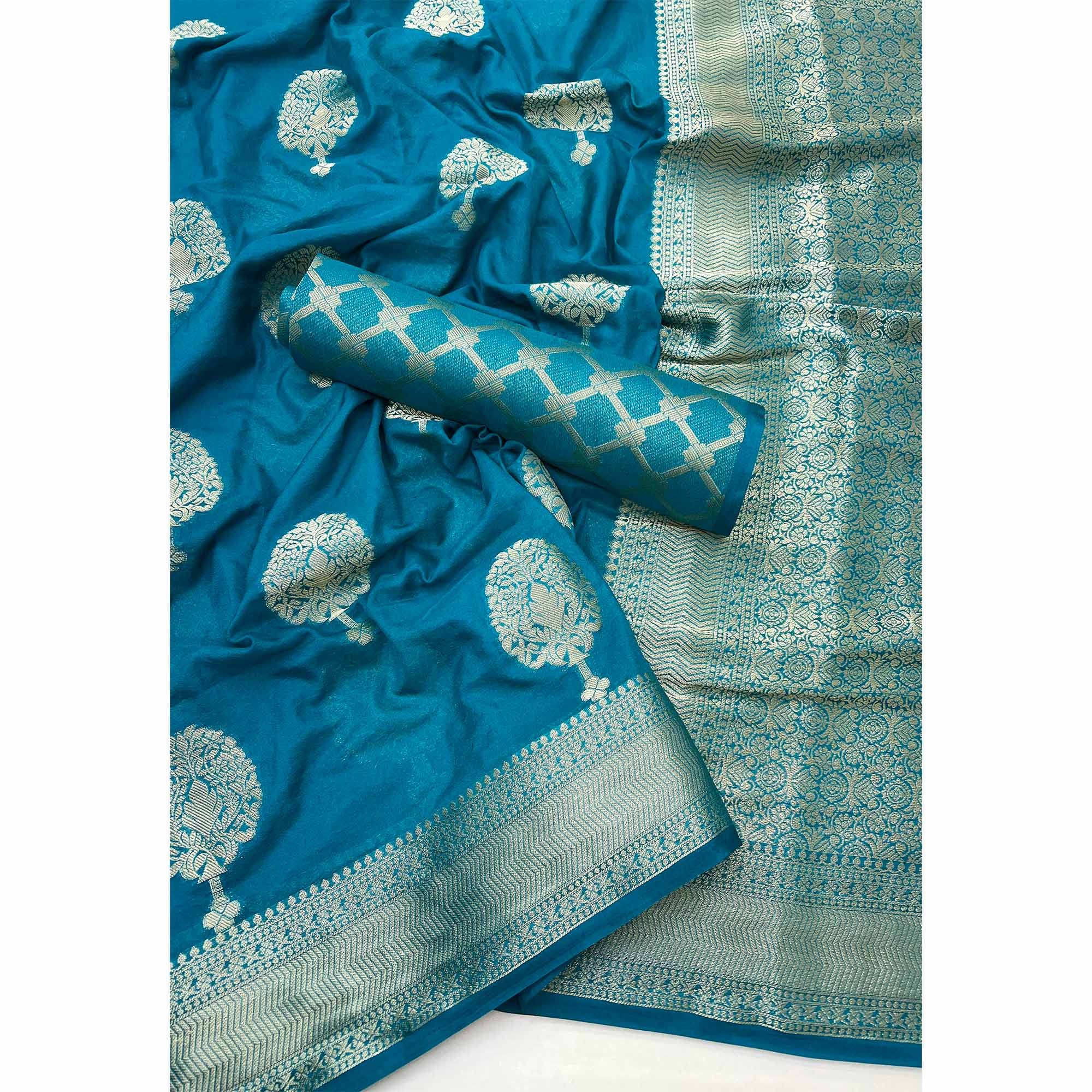 Teal Blue Crepe Silk Saree Featuring Floral Zari Weave & Graceful Tassel Pallu
