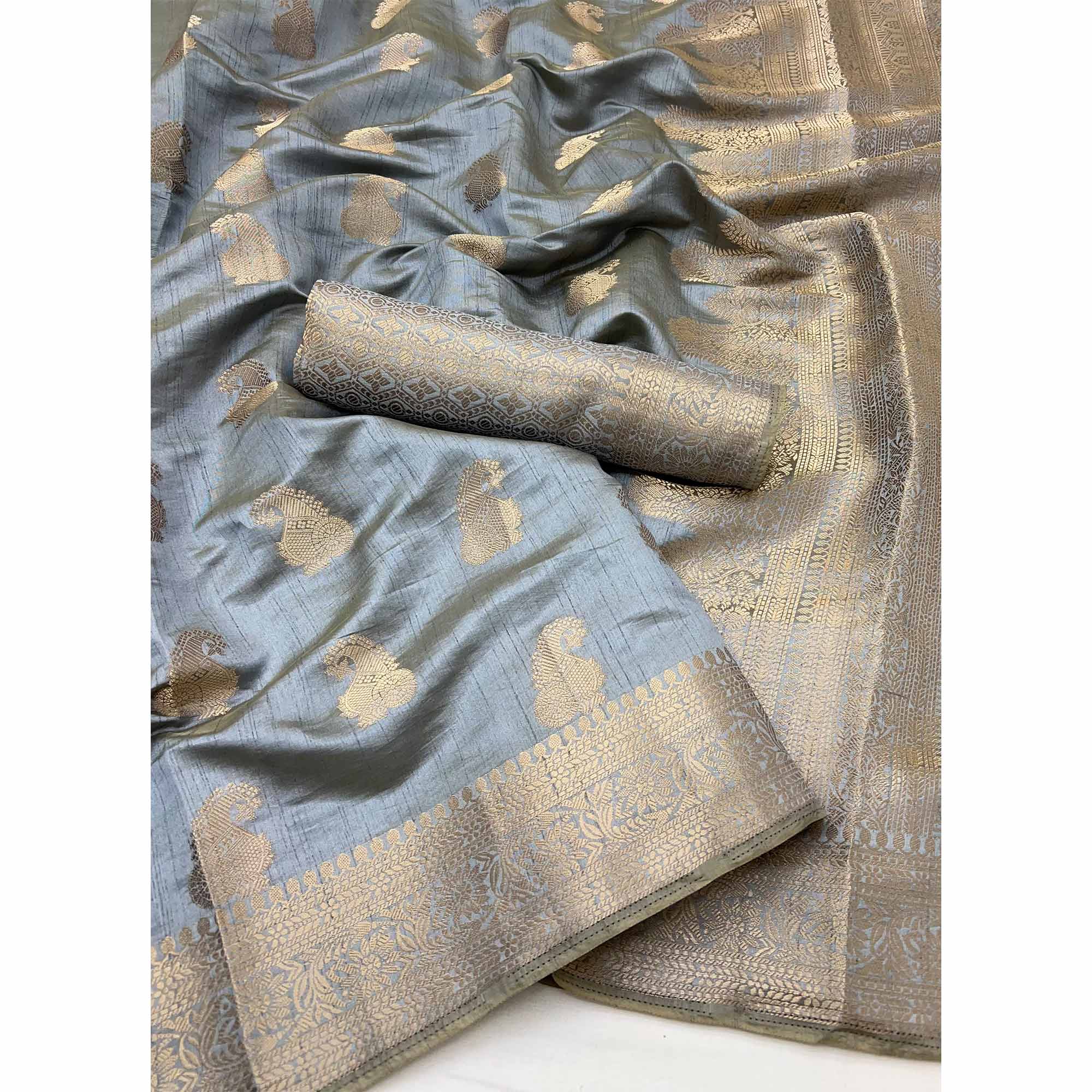 Grey Tusser Cotton Silk Saree Adorned With Floral Zari Weave & Tassel Pallu